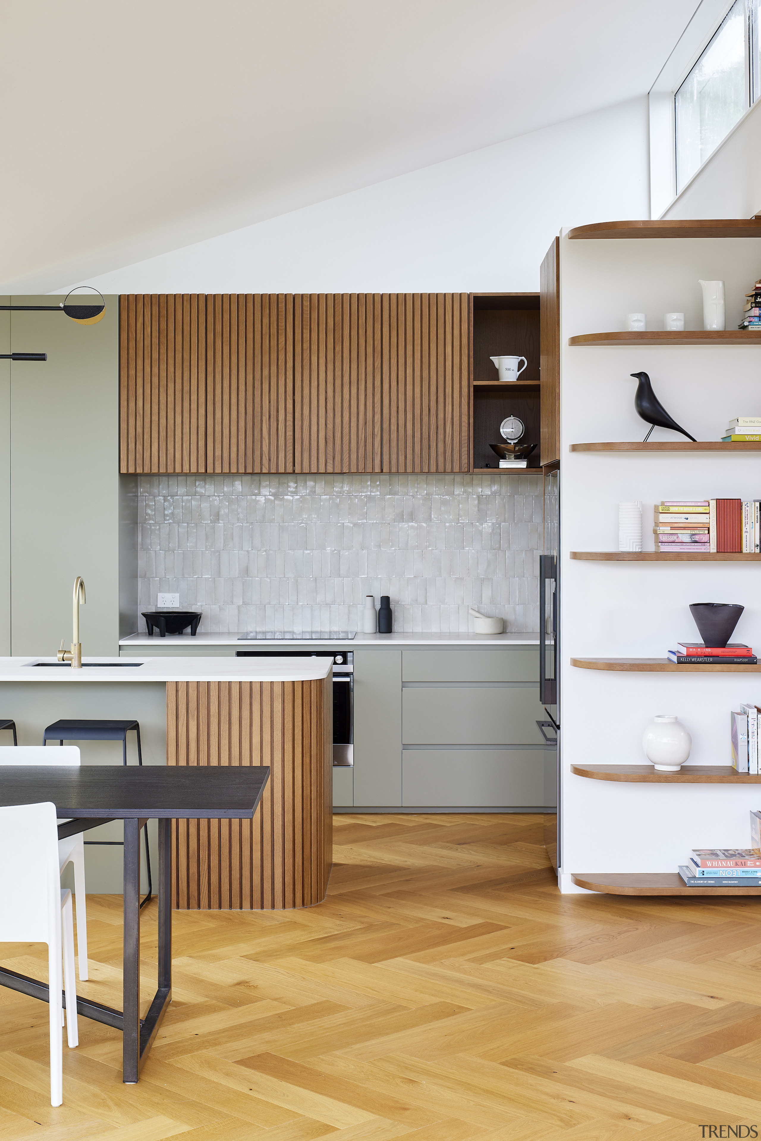 An open shelving unit integrates into the main 