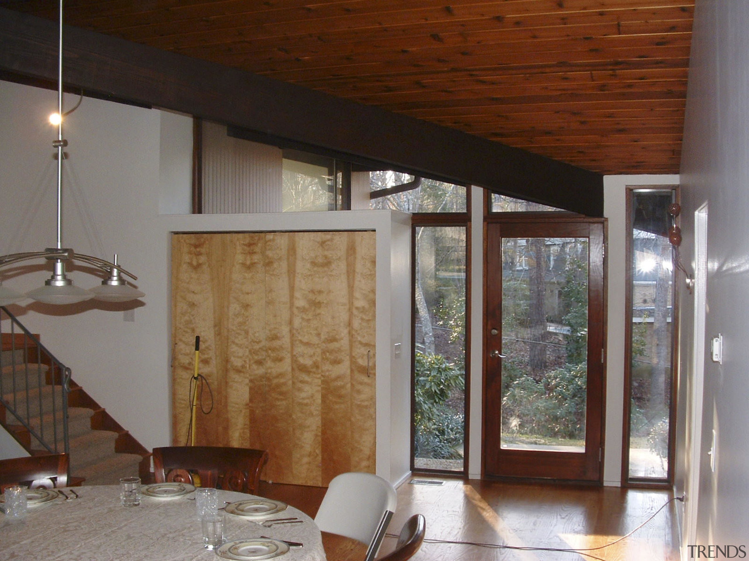 Post and beam house entry before renovation - architecture, beam, ceiling, door, floor, flooring, home, house, interior design, real estate, wall, window, wood, wood stain, gray, brown