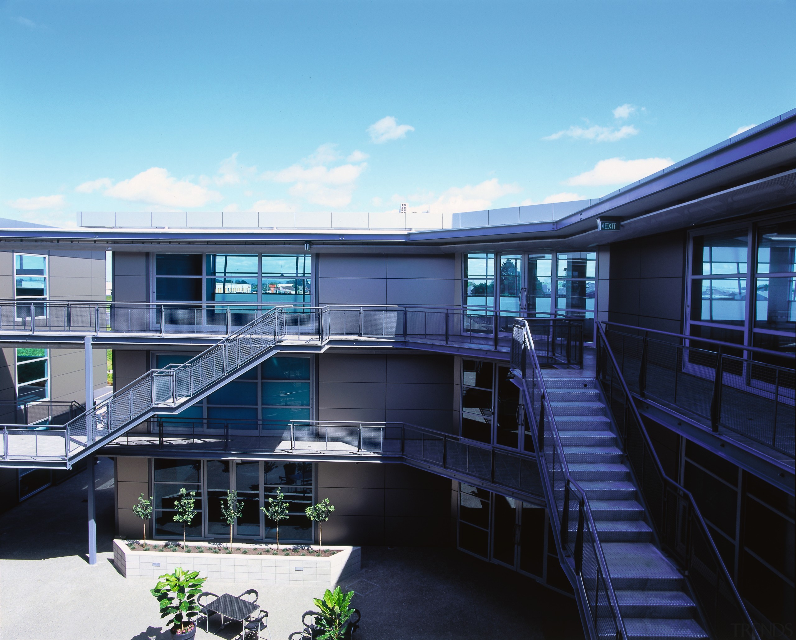 A view of the Jalcon homes building. - apartment, architecture, building, commercial building, condominium, corporate headquarters, facade, headquarters, house, mixed use, real estate, blue, teal