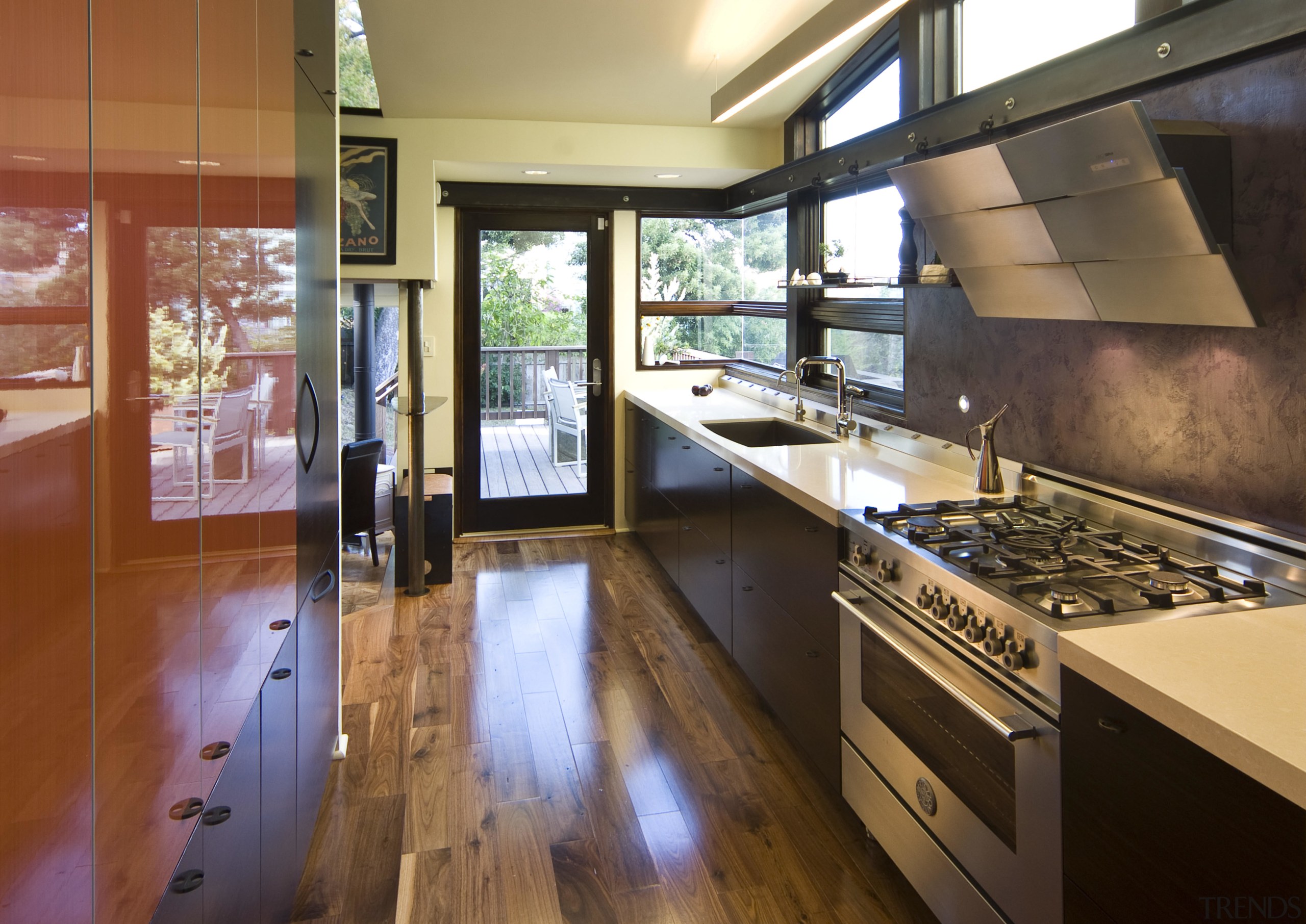 View of a remodeled kitchen which features custom countertop, flooring, interior design, kitchen, real estate, brown