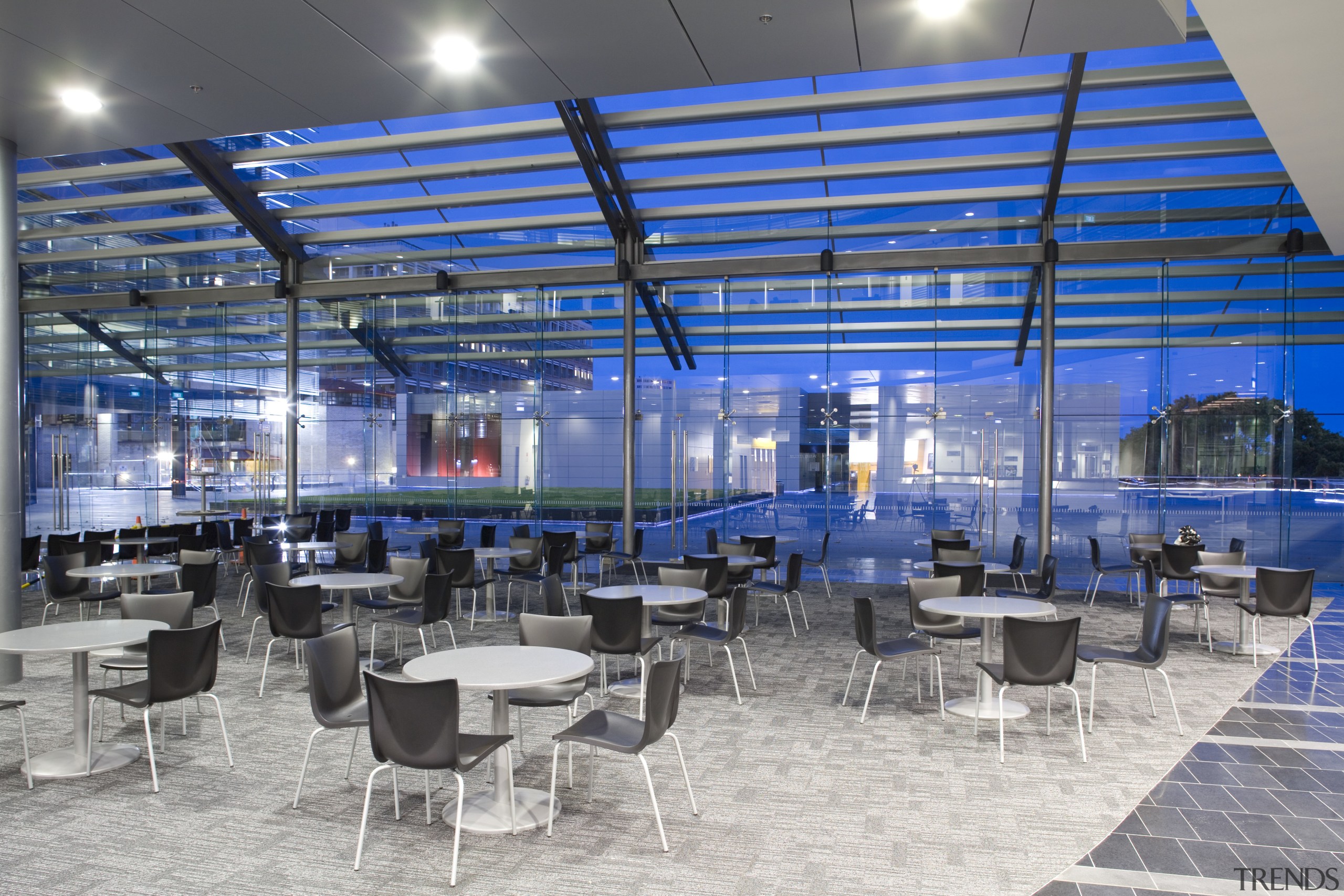 interior view of the Owen G Glenn Building cafeteria, daylighting, gray, blue