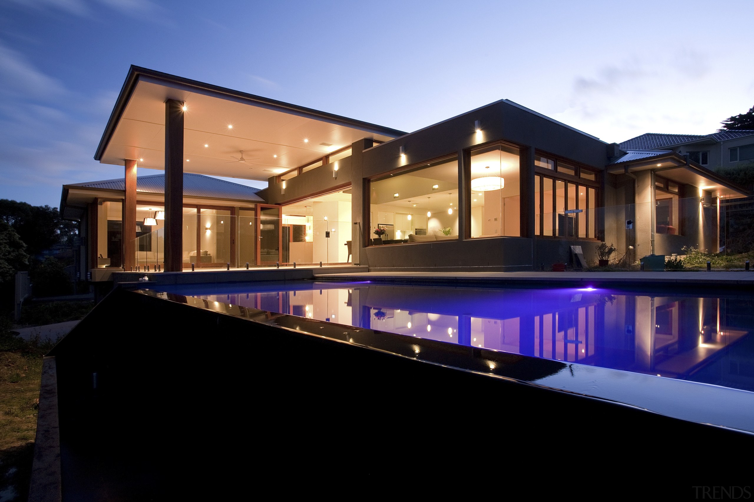 Exterior view of east facing house and pool. architecture, estate, facade, family car, home, house, lighting, property, real estate, reflection, residential area, roof, swimming pool, villa, window, black