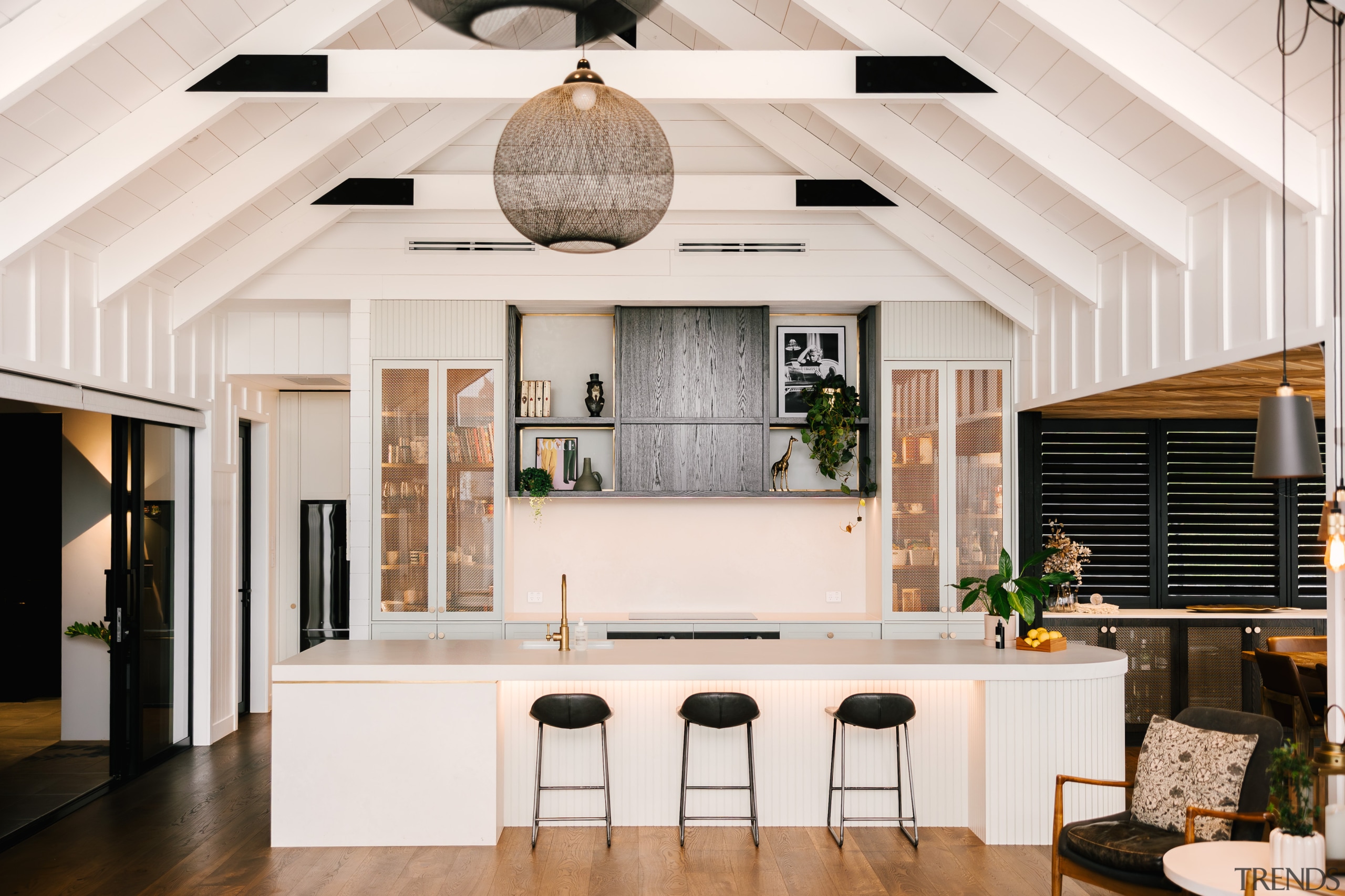 Mesh and glass cabinet fronts add lightness to 