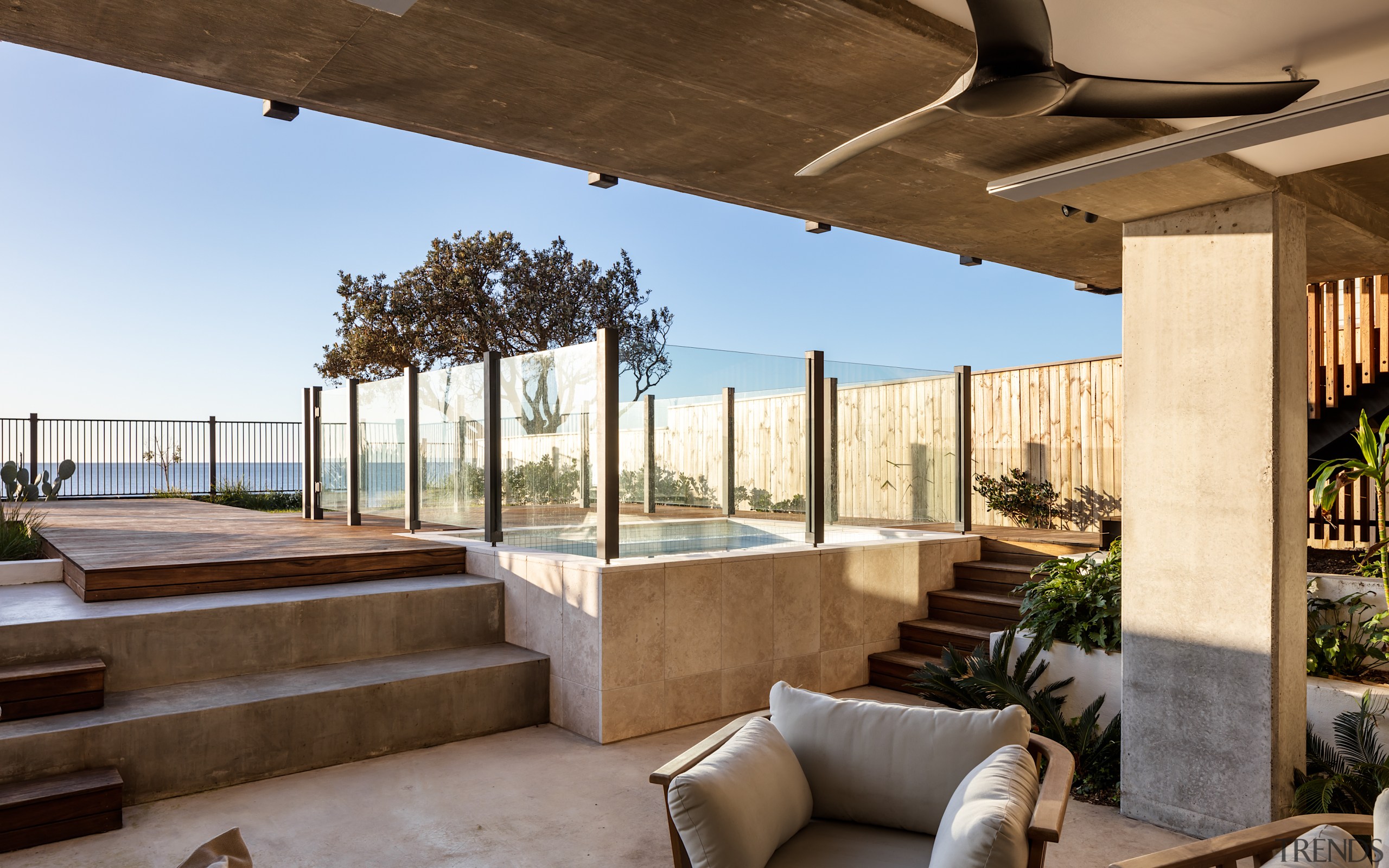 Underneath the rear cantilevered balcony, a semi-underground terrace 