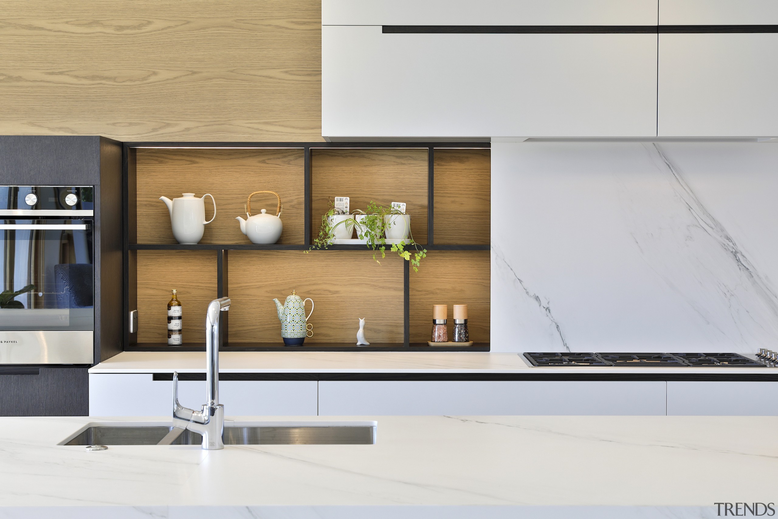 The opulent display shelving adds to the kitchen's 