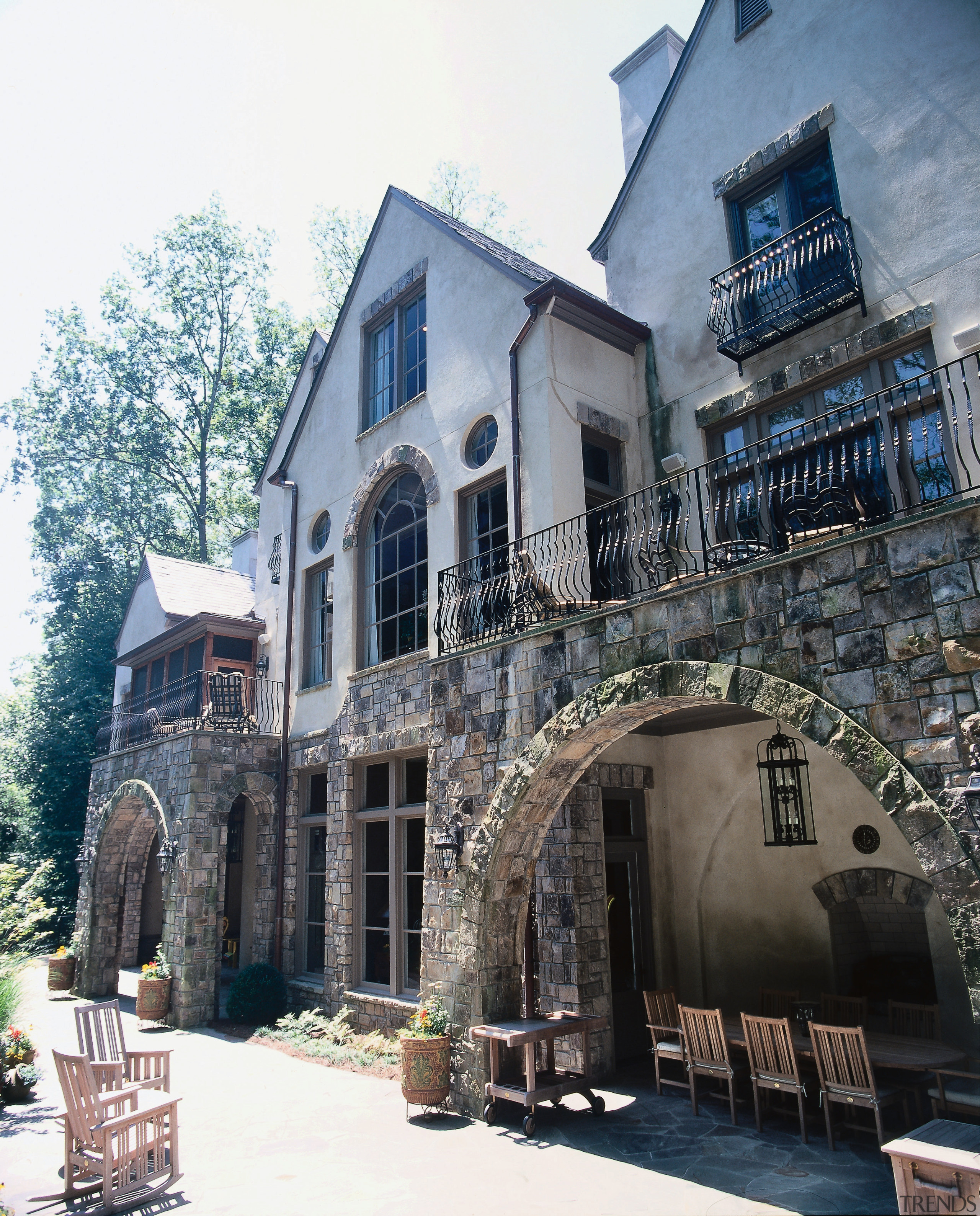 View of Normandy style home with stone and architecture, building, facade, home, house, mansion, medieval architecture, neighbourhood, real estate, window, white, black