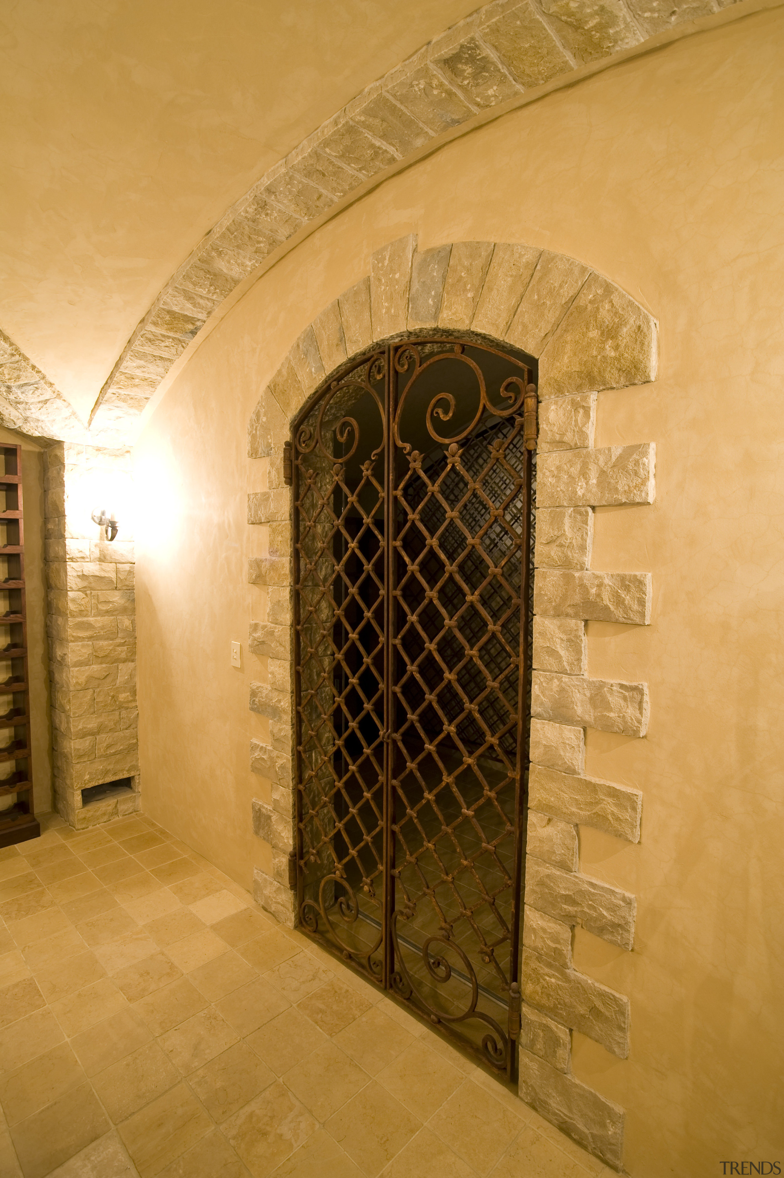 View of a wine cellar which features limestone arch, architecture, door, estate, wall, wine cellar, winery, orange