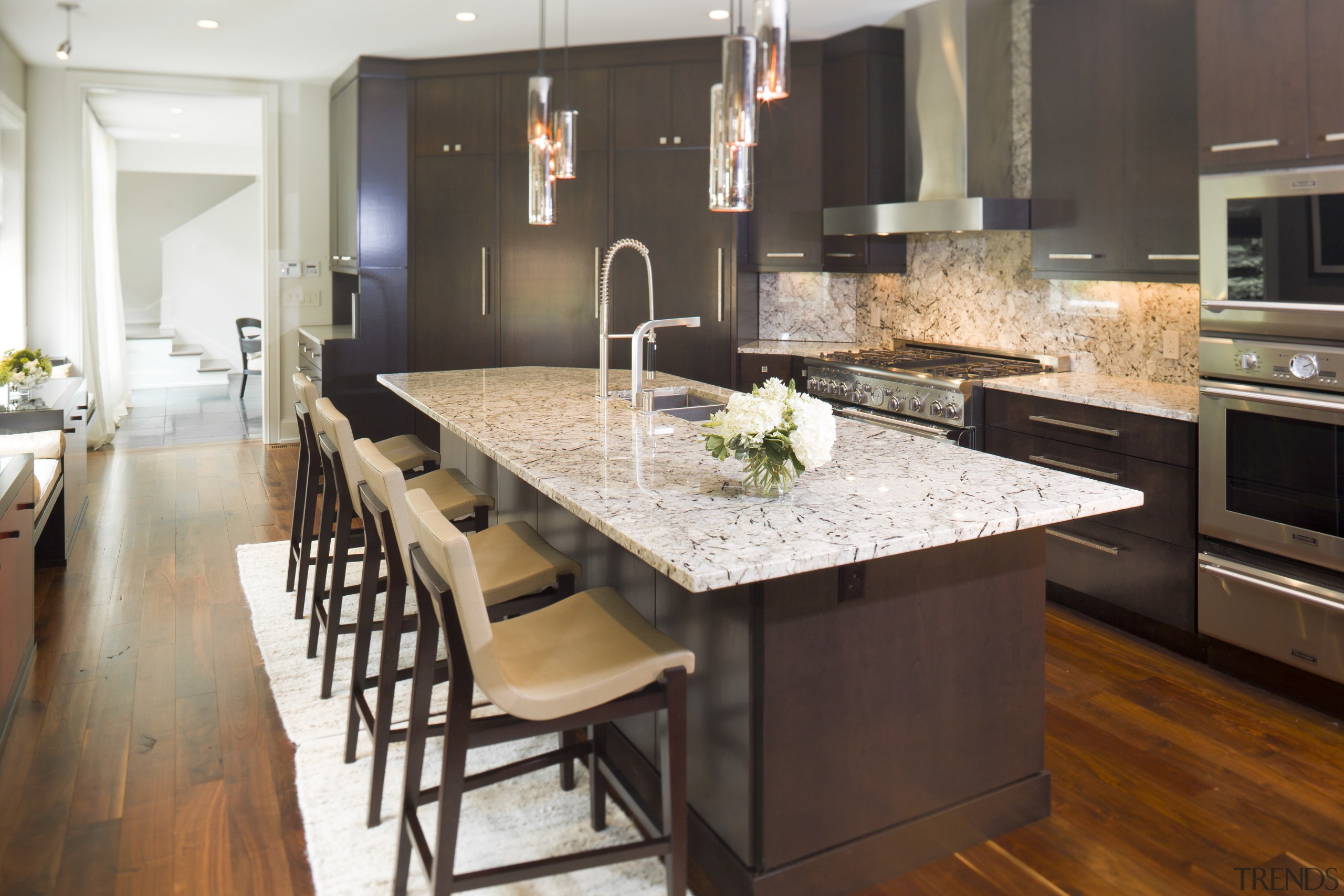 This is a home designed by John Behal cabinetry, countertop, cuisine classique, dining room, floor, flooring, hardwood, interior design, kitchen, laminate flooring, room, wood flooring, black, white