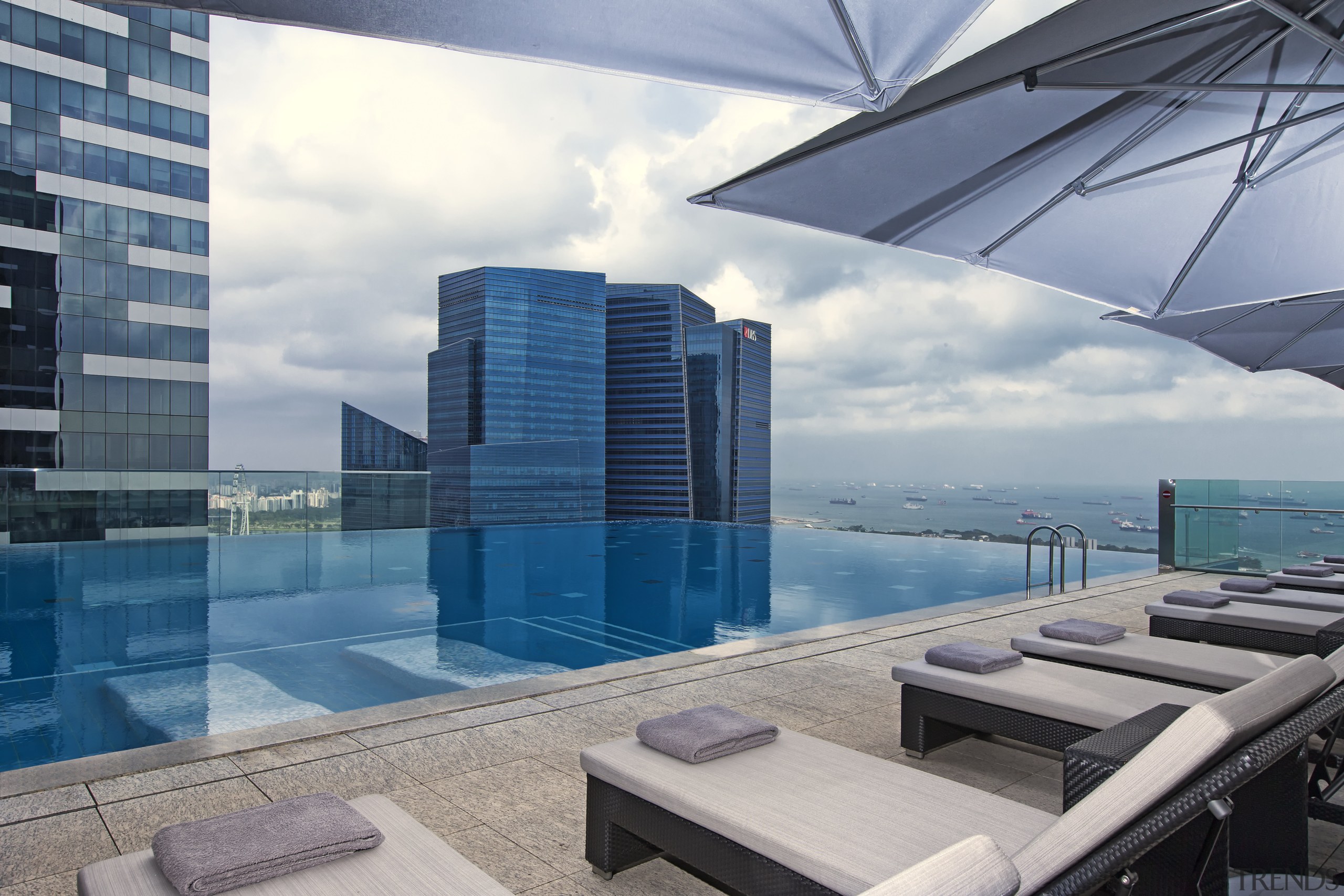 The Westin Singapore has a rooftop infinity swimming apartment, architecture, building, condominium, corporate headquarters, daylighting, penthouse apartment, property, real estate, sky, swimming pool, gray