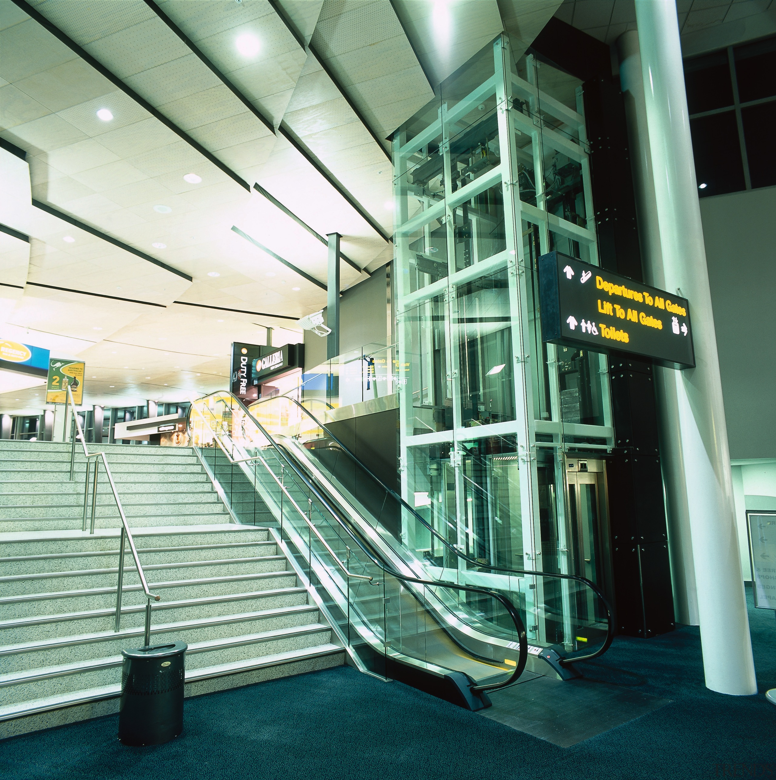 View of stairway, escalator and glass enclosed elevator. airport terminal, escalator, leisure, leisure centre, sport venue, structure, green, teal