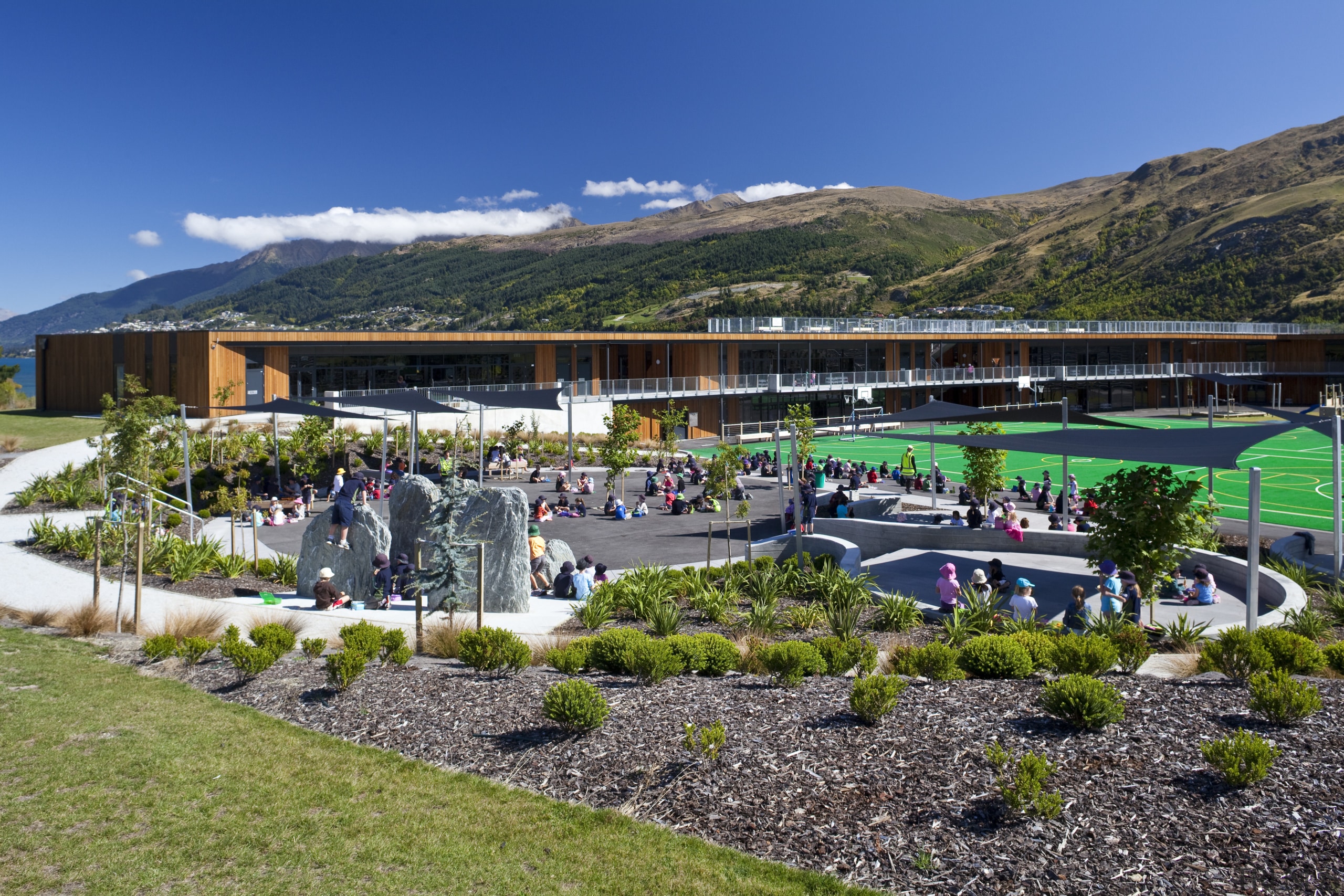 View of Remarkables Primary School in Queenstown. - city, landscape, leisure, mountain, plant, real estate, sky, tree, water, blue
