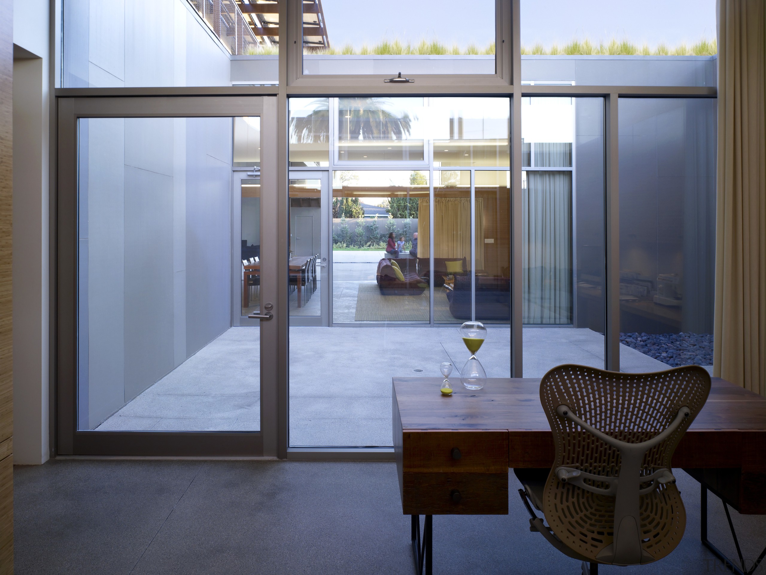 Enjoying a long line of sight, this home architecture, daylighting, door, glass, house, interior design, property, real estate, window, teal