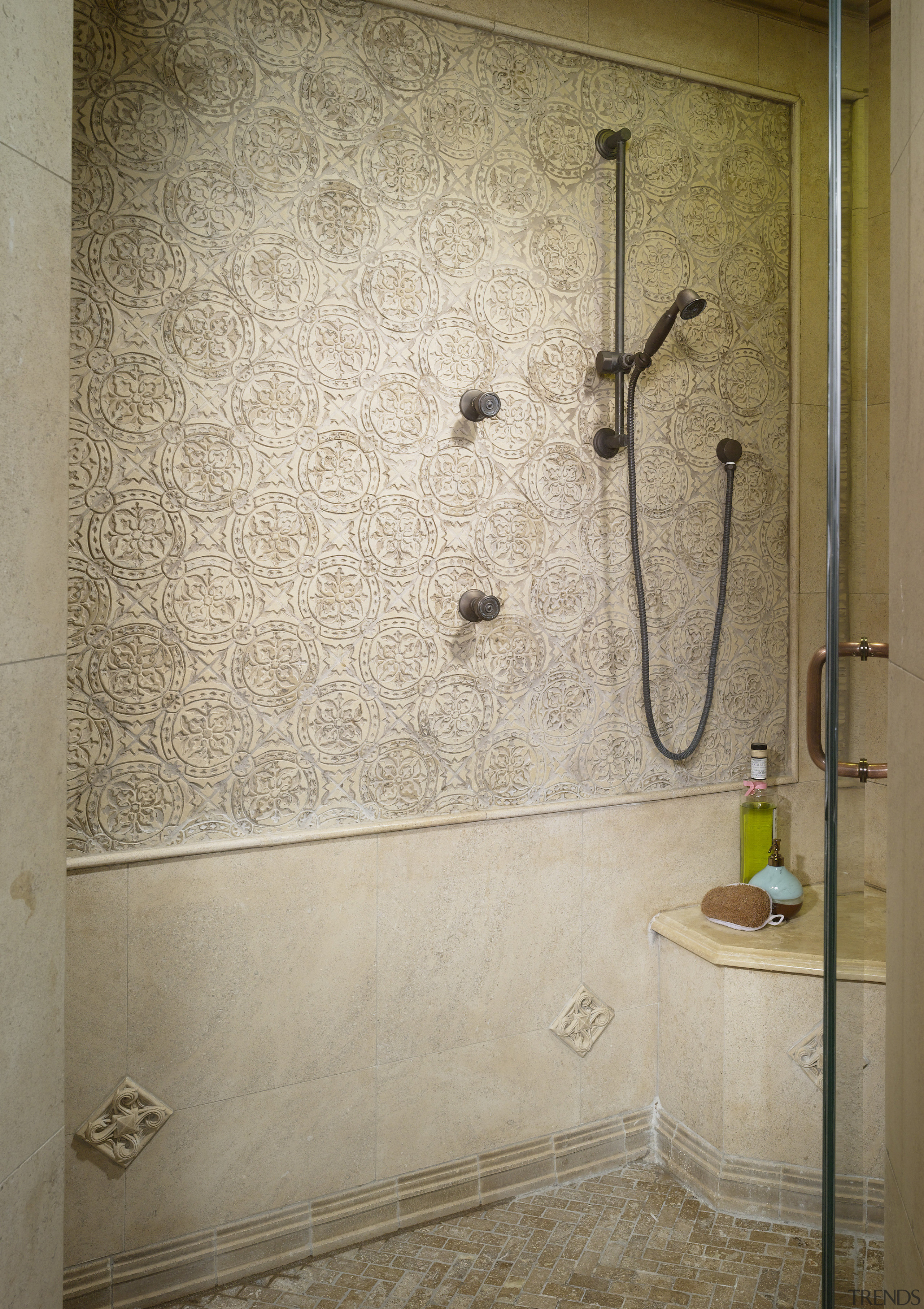 View of the shower enclosure which features embossed bathroom, floor, interior design, plumbing fixture, room, shower, tile, wall, orange, brown