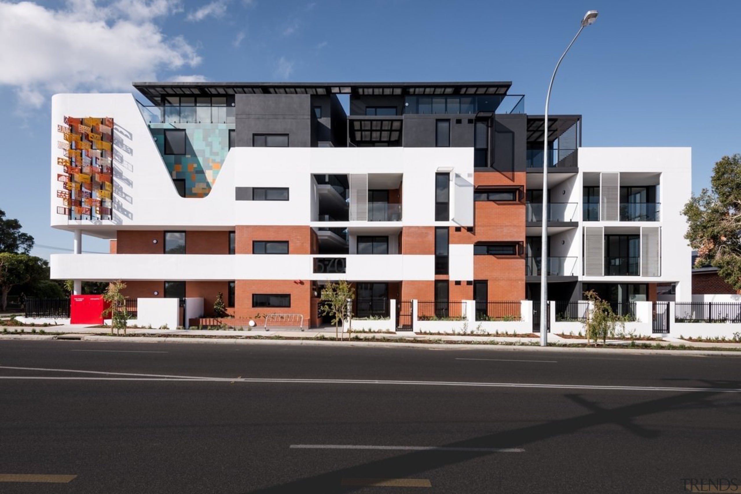 The complex, viewed from across the street - apartment, architecture, building, commercial building, condominium, corporate headquarters, elevation, facade, home, house, mixed use, neighbourhood, property, real estate, residential area, black