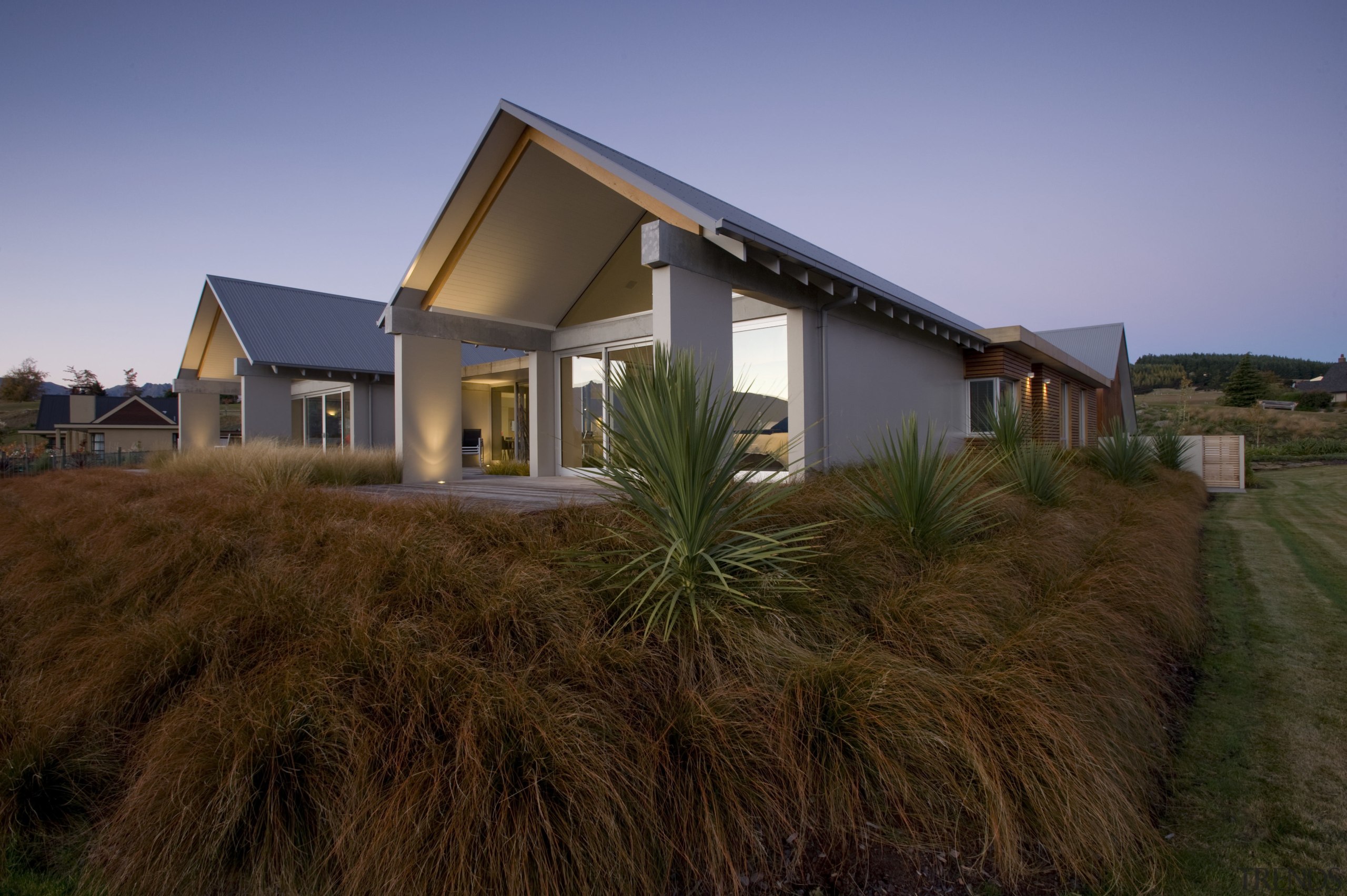 Exterior view of home with a gabled roof, cottage, estate, facade, farmhouse, grass, home, house, landscape, property, real estate, residential area, sky, brown, blue