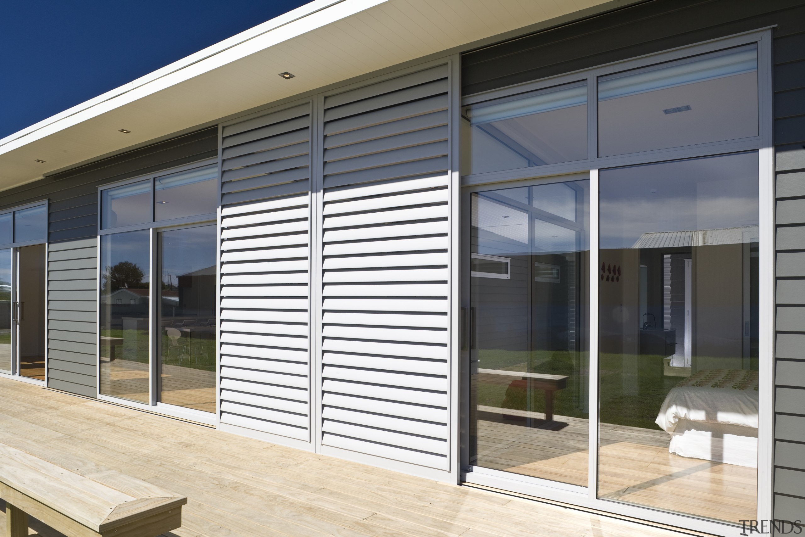 Exterior view of a future-proof Jennian Homes show daylighting, door, facade, glass, house, interior design, real estate, shade, siding, window, window blind, window covering, window treatment, white