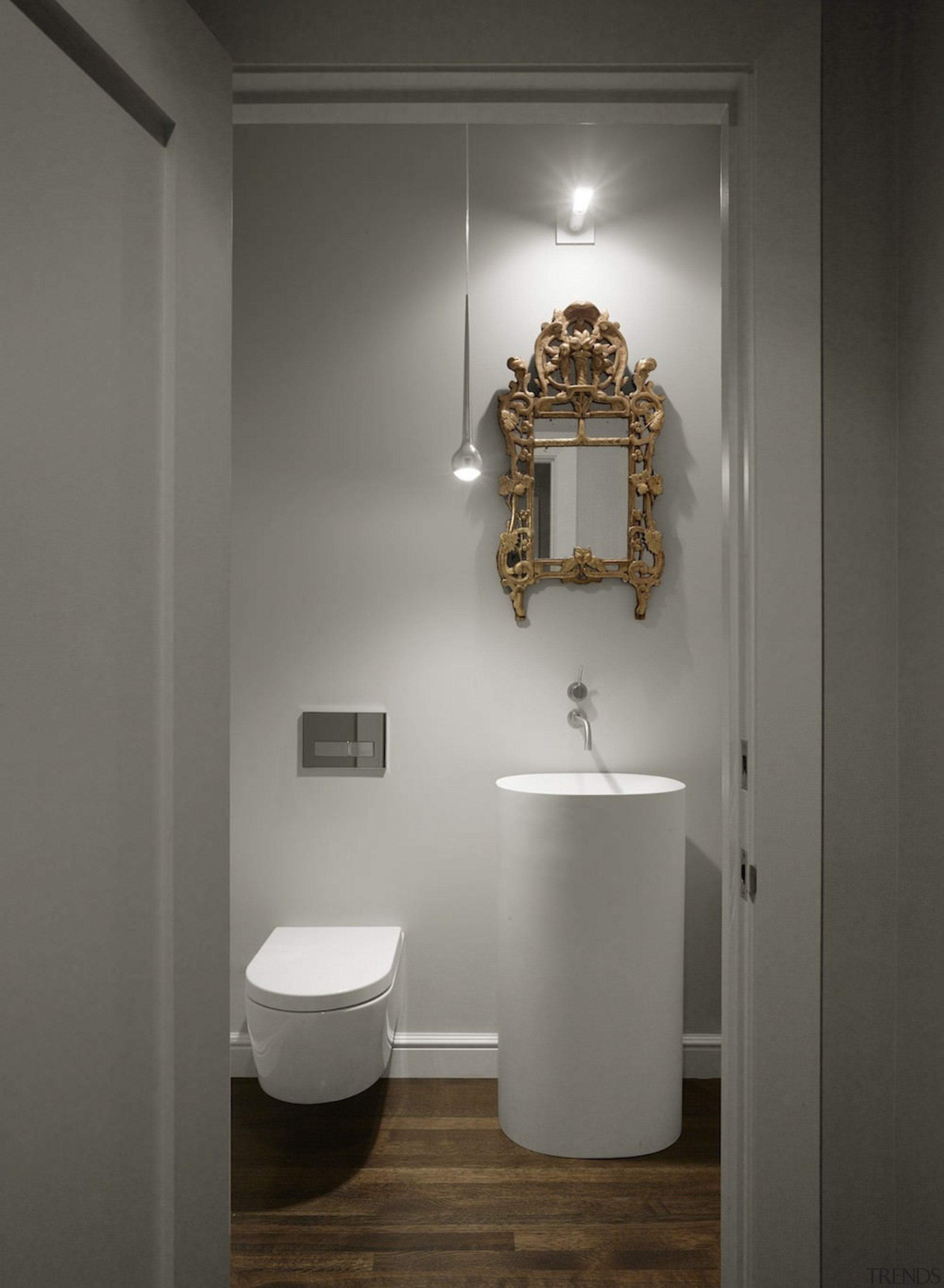 A powder room with an interesting mirror - bathroom, bathroom accessory, ceiling, ceramic, interior design, light fixture, plumbing fixture, product design, room, sink, tap, toilet, wall, gray