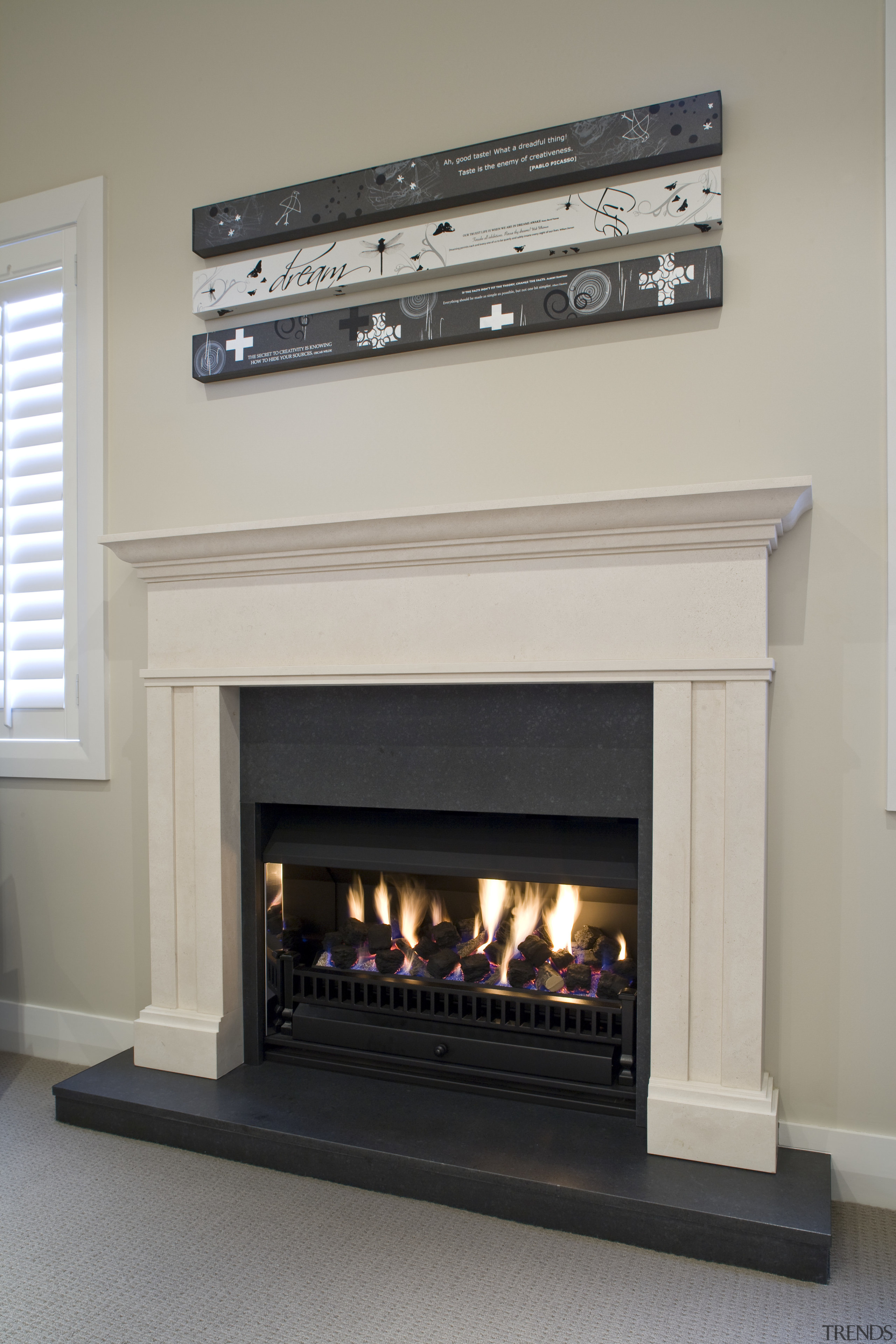 View of a hand-crafted stone mantle by The fireplace, hearth, gray