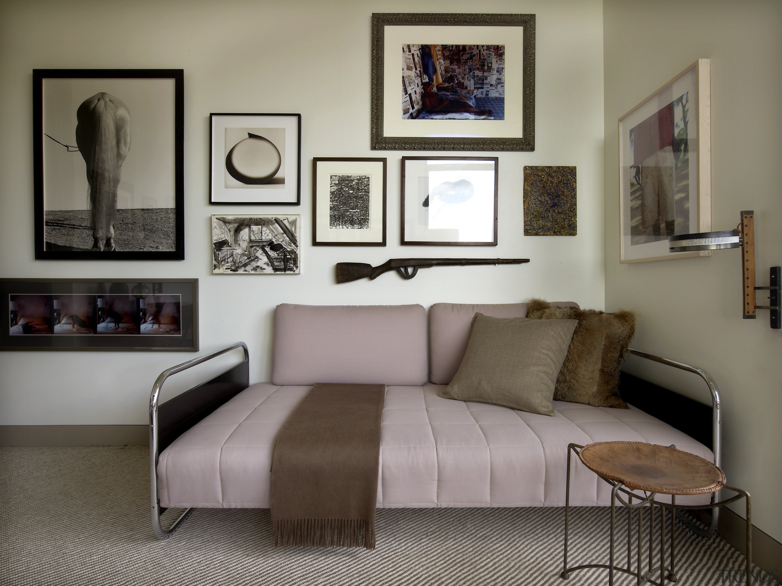 Textural furnishings add visual interest to this guest bed, bed frame, bedroom, couch, furniture, home, interior design, living room, room, table, wall, gray