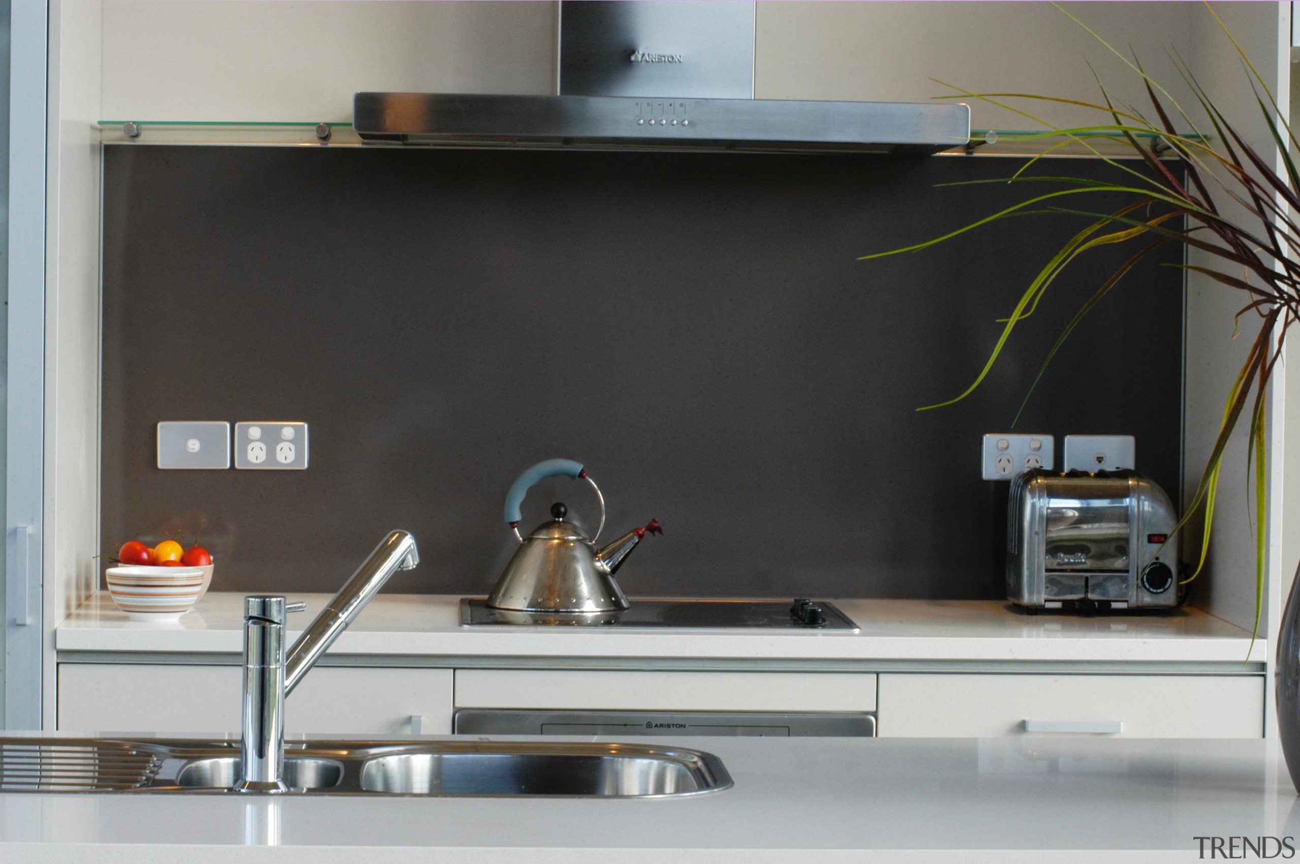 Kitchen with light grey cabinetry and white benchtop, countertop, furniture, product design, gray, black