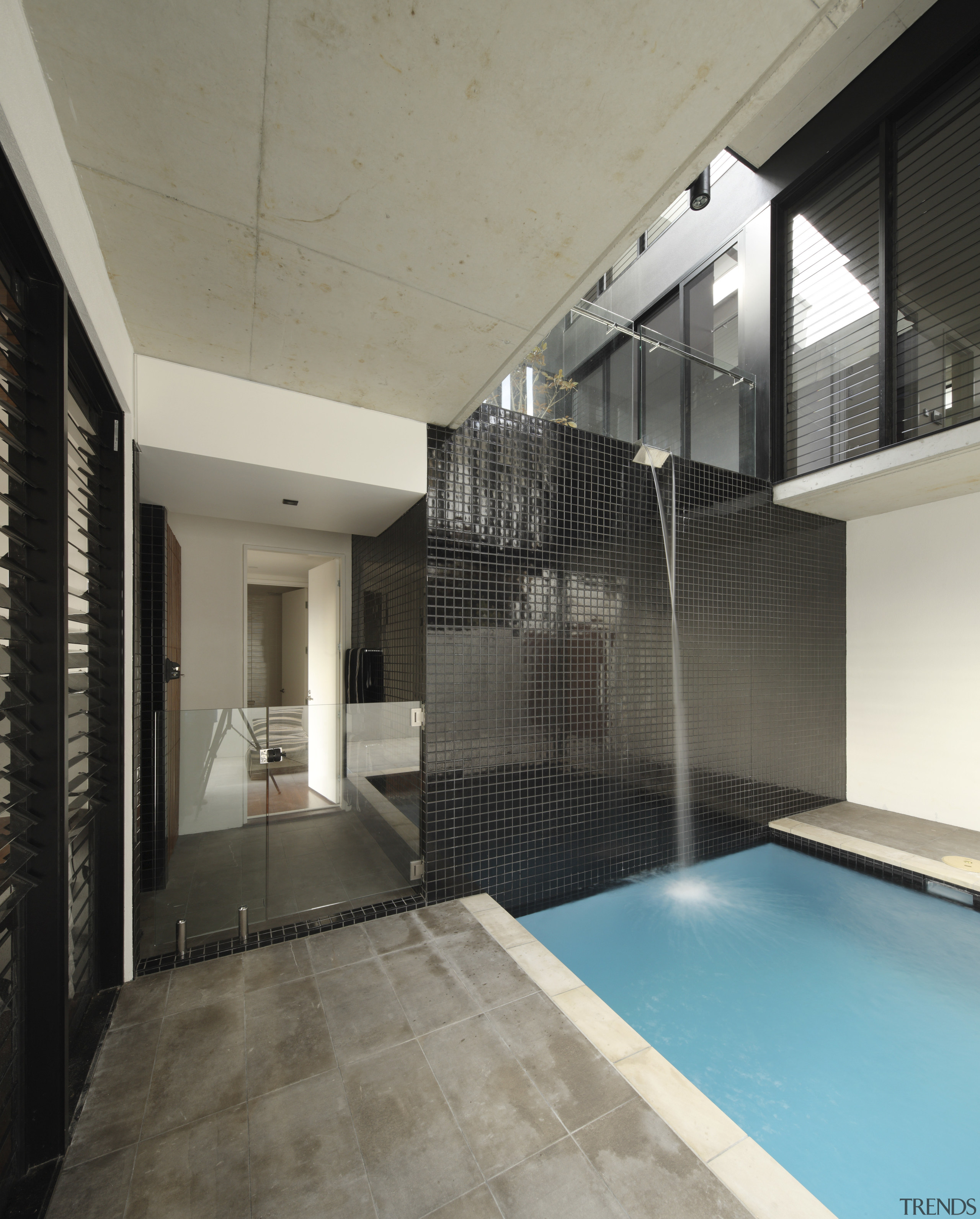 This plunge pool on the second level of apartment, architecture, ceiling, daylighting, estate, floor, glass, house, interior design, property, real estate, window, gray, black