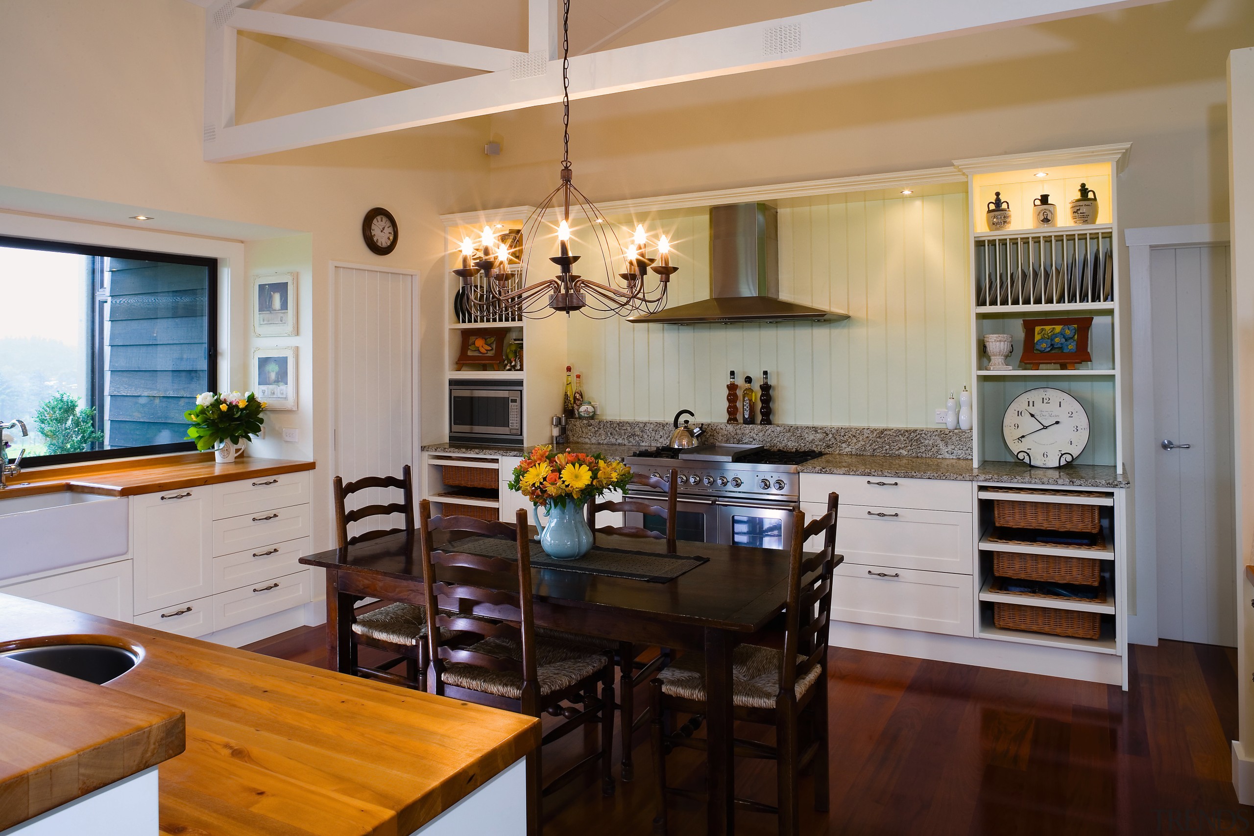 A view of some custom made kitchen cabinetry gray