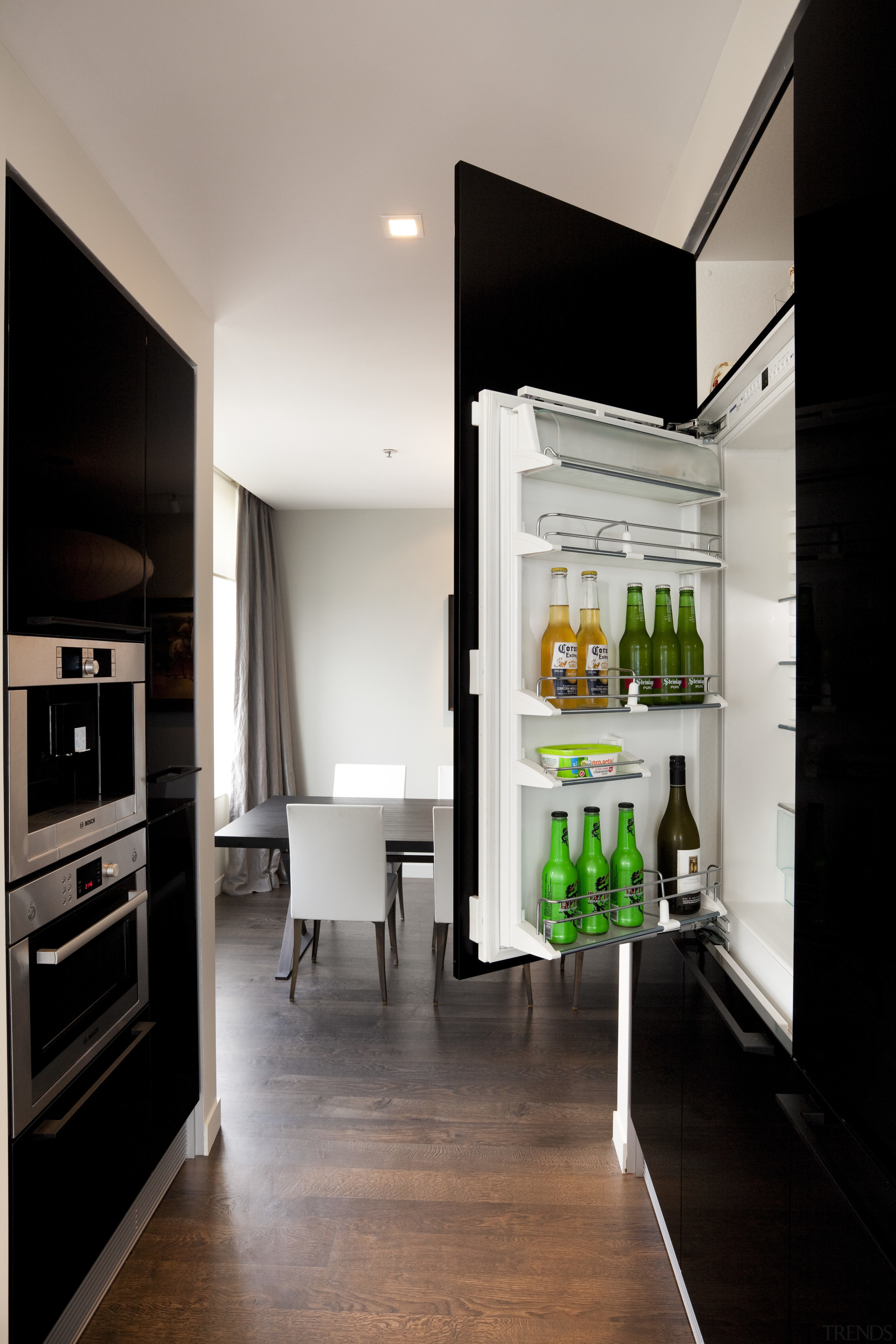 integrated fridge behind dark cabinets - integrated fridge furniture, interior design, kitchen, room, gray, black