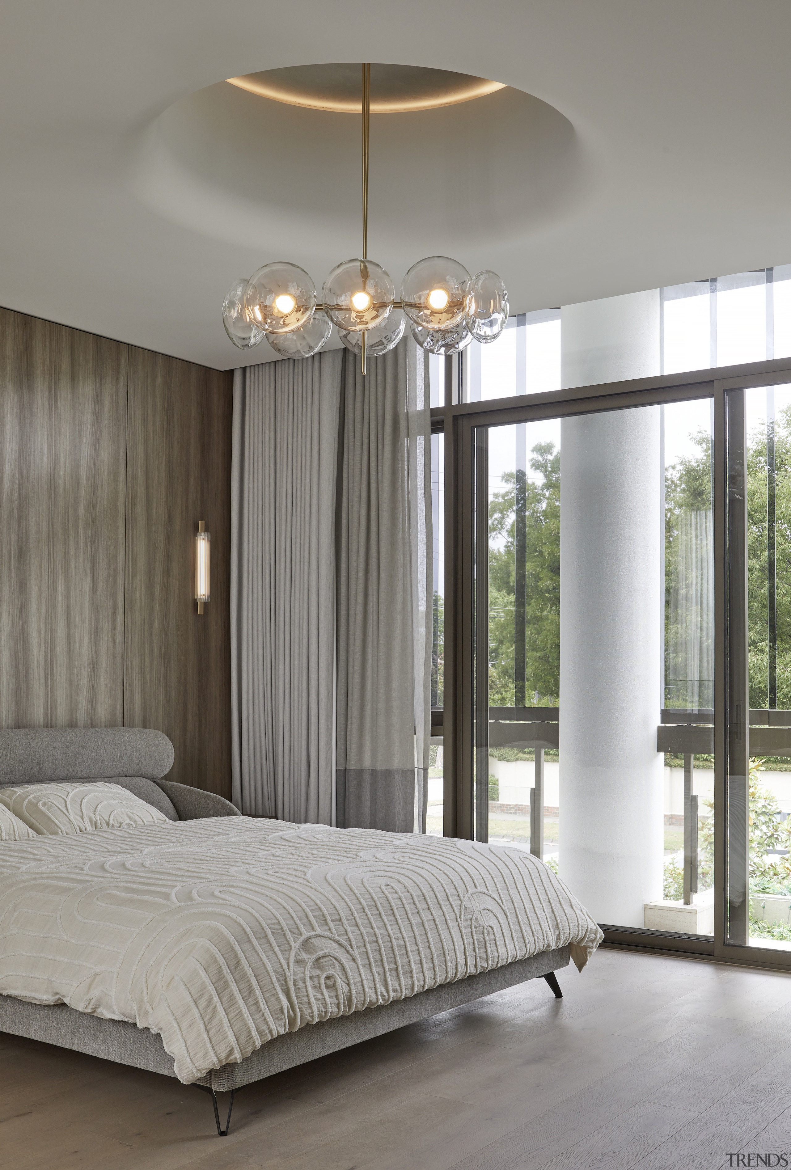 Soft drapes, floor-to-ceiling windows and a glamorous ceiling 