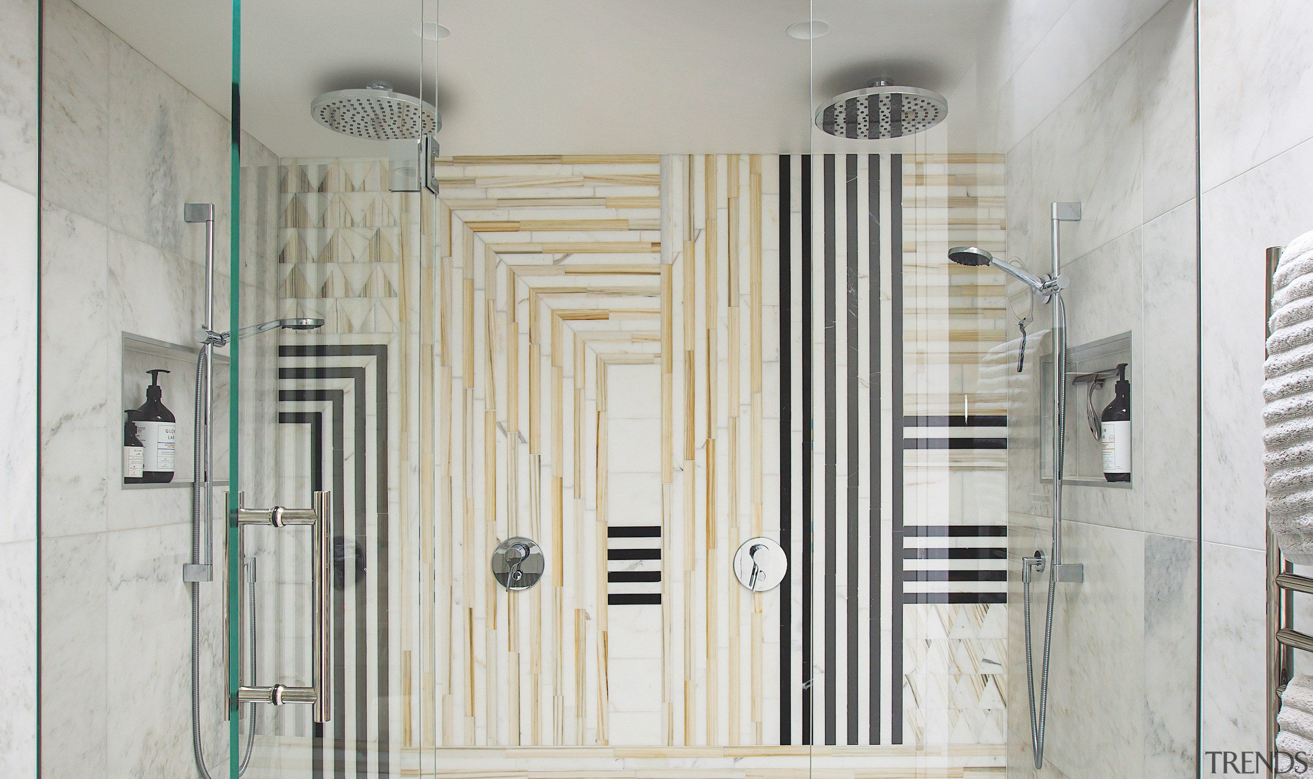 The generous shower stall has a his and 