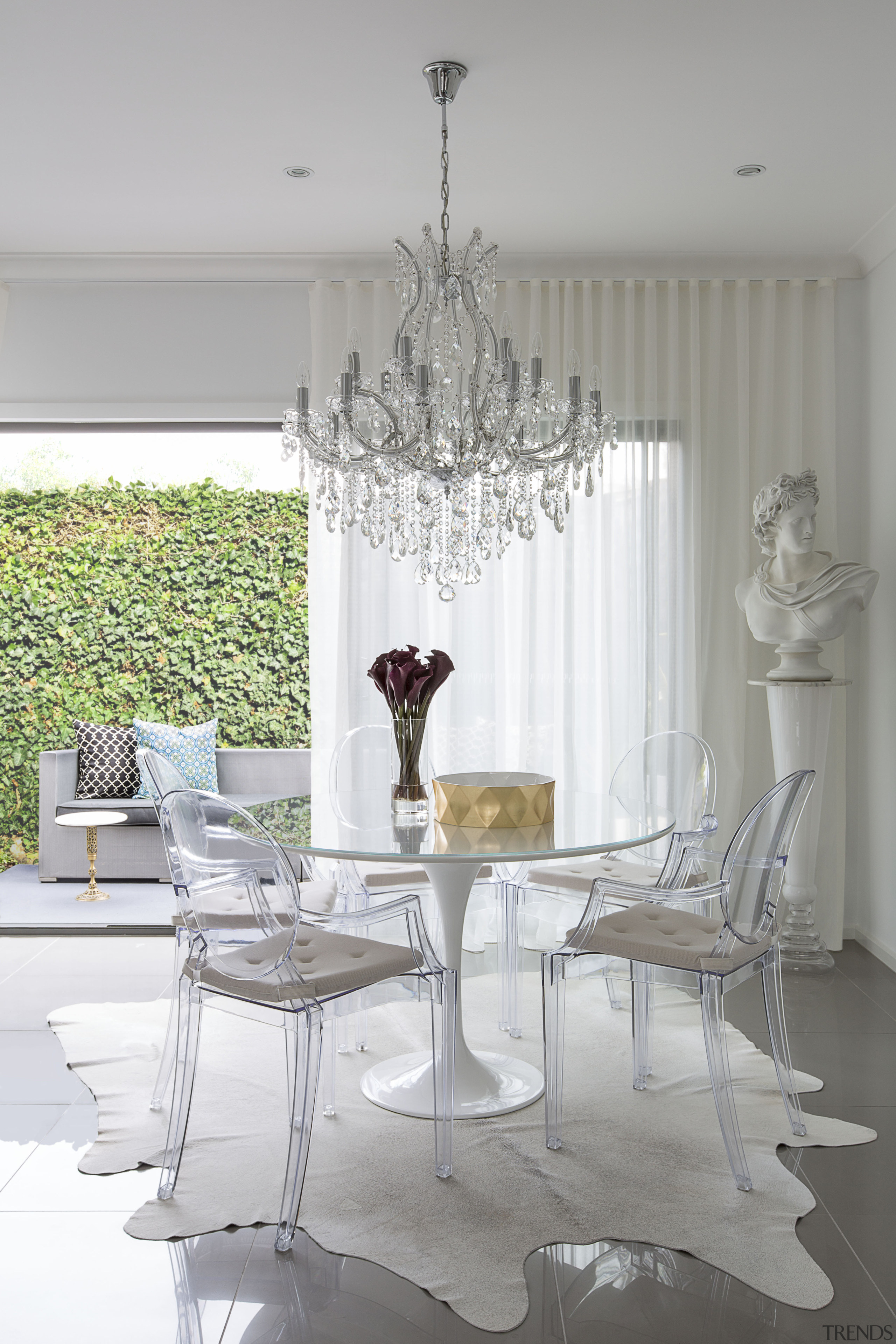 This classic-meets-modern interior is by Massimo Speroni chair, chandelier, dining room, furniture, home, interior design, light fixture, living room, room, table, window, gray, white