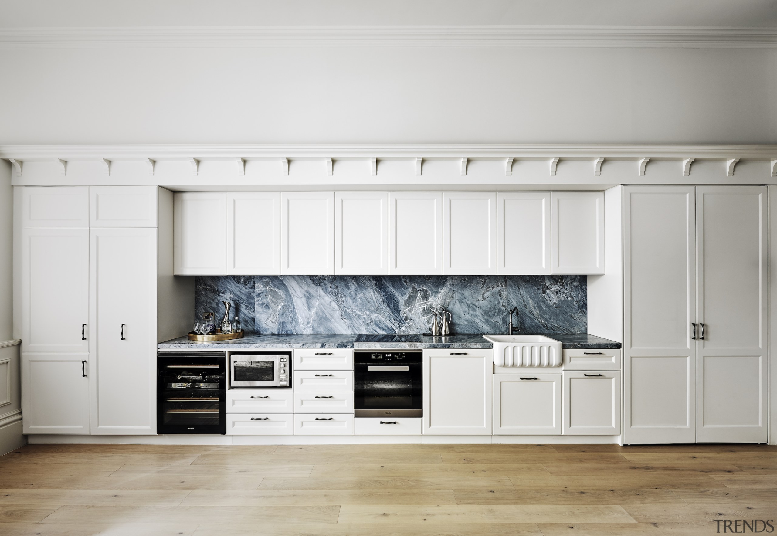 Flush full height doors and hidden drawers keep 