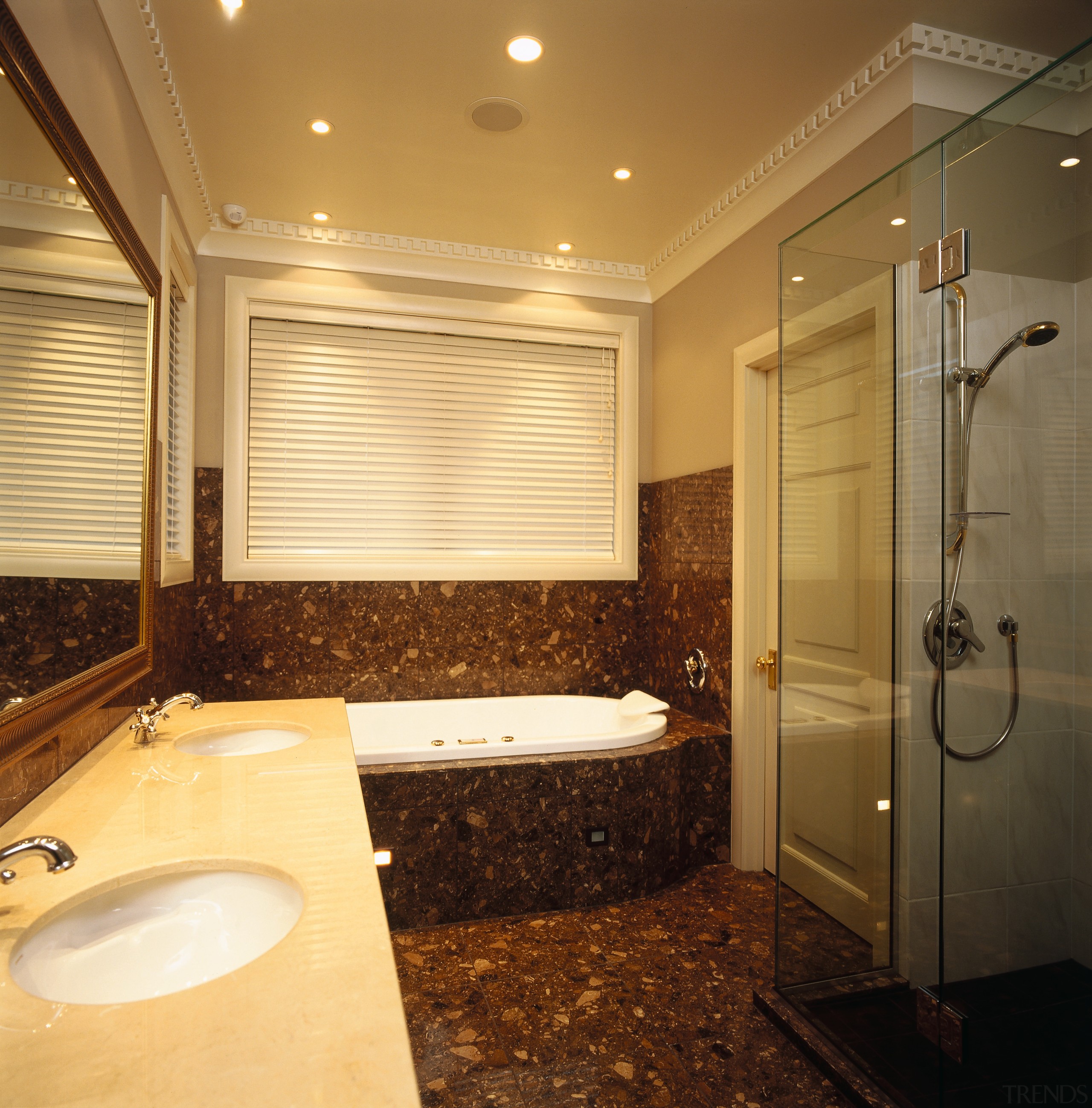 The view of a bathroom featuring a frameless bathroom, ceiling, floor, flooring, home, interior design, lighting, real estate, room, window, brown, orange