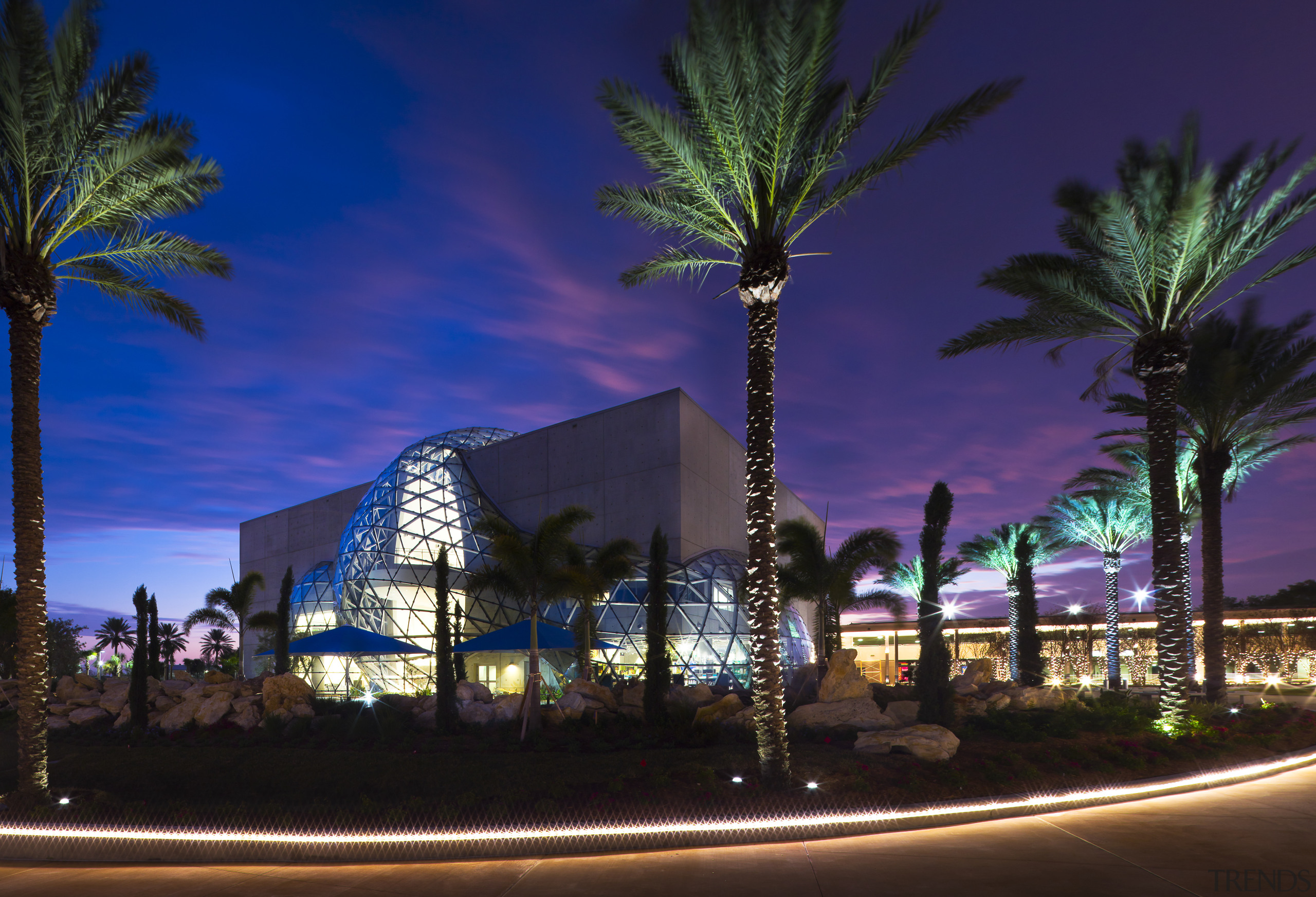 View of new art museum designed to house architecture, arecales, city, cityscape, computer wallpaper, downtown, evening, hotel, landmark, landscape lighting, lighting, metropolitan area, mixed use, night, palm tree, plant, reflection, resort, sky, tourist attraction, tree, blue, black