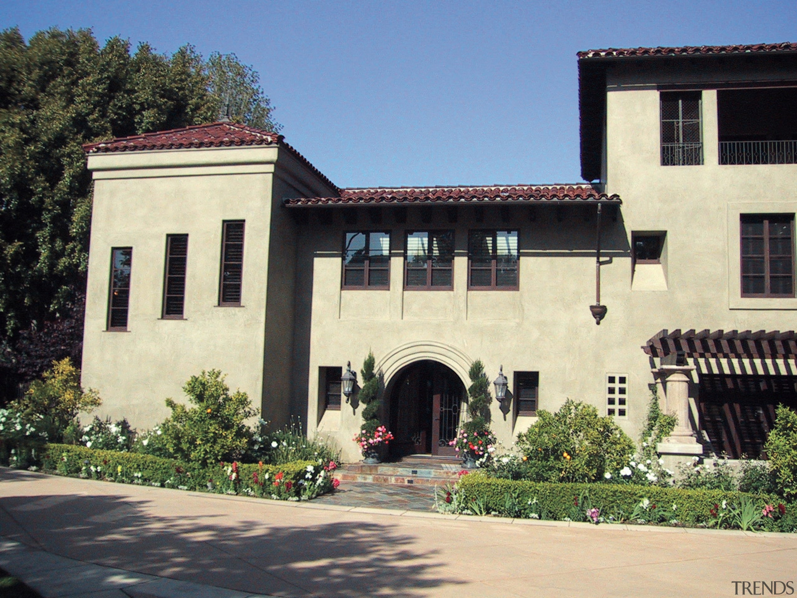 This spanish-style residence was transformed by the Landry building, estate, facade, home, house, mansion, tree, window, black