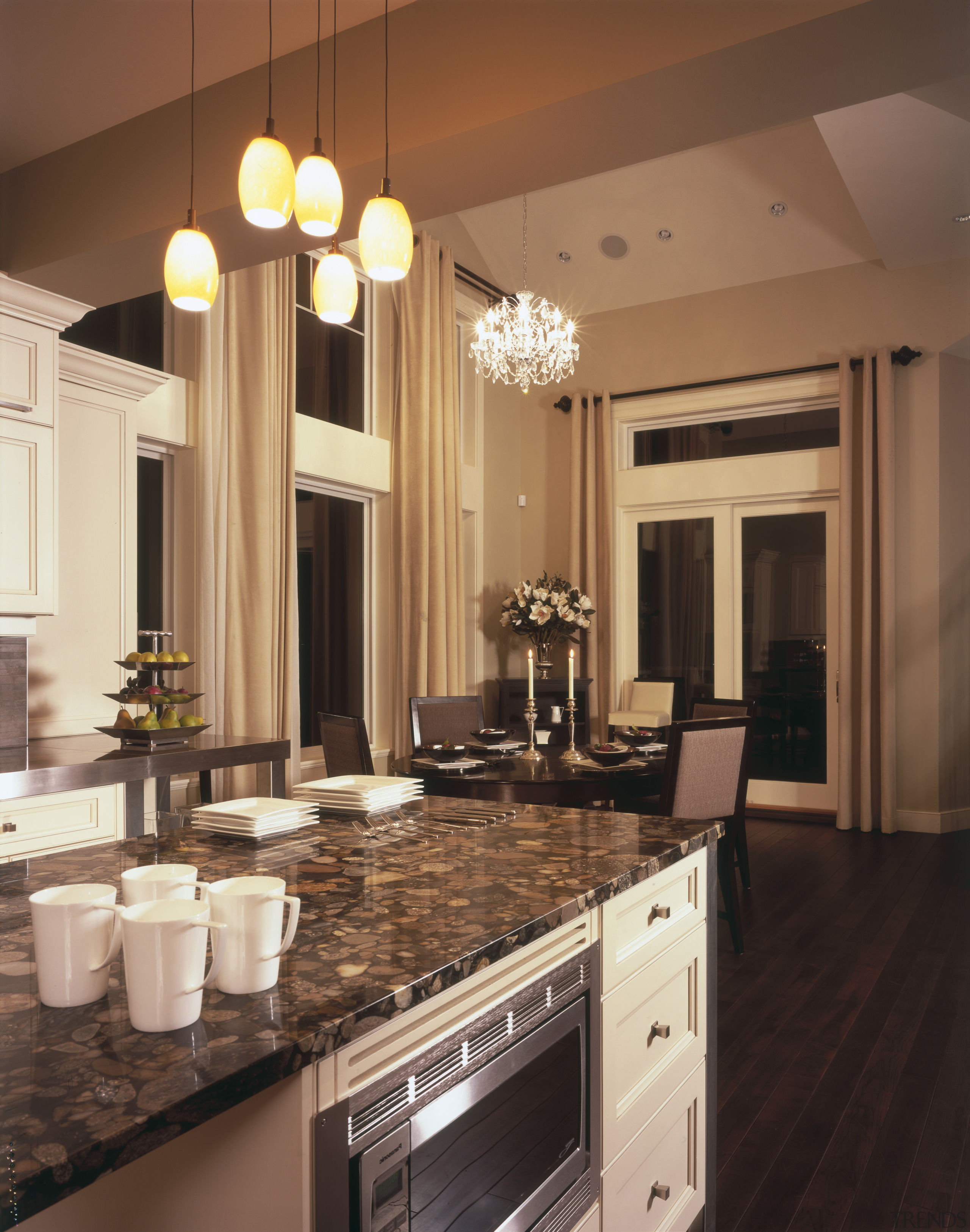 Pertified river stone is used to top the cabinetry, ceiling, countertop, cuisine classique, flooring, hardwood, interior design, kitchen, light fixture, lighting, room, under cabinet lighting, brown, orange