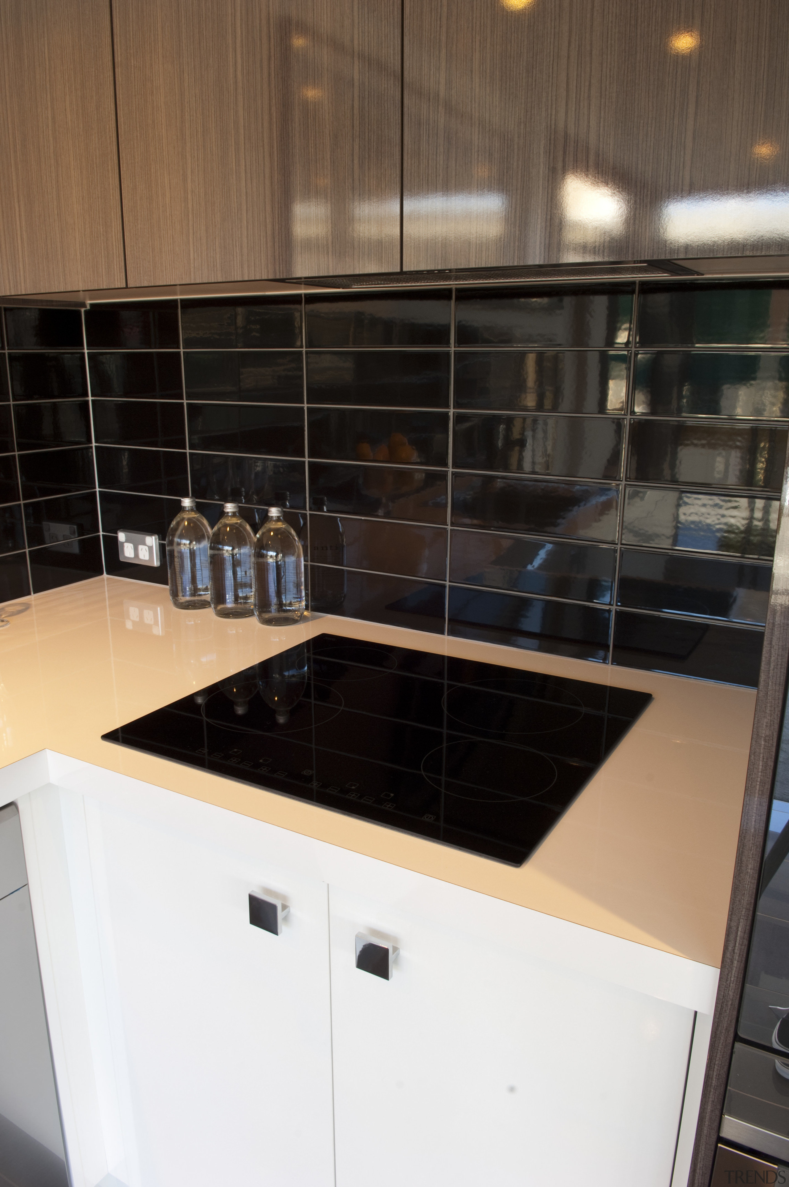 Black cooktop on white bench. - Black cooktop countertop, kitchen, room, sink, tile, black