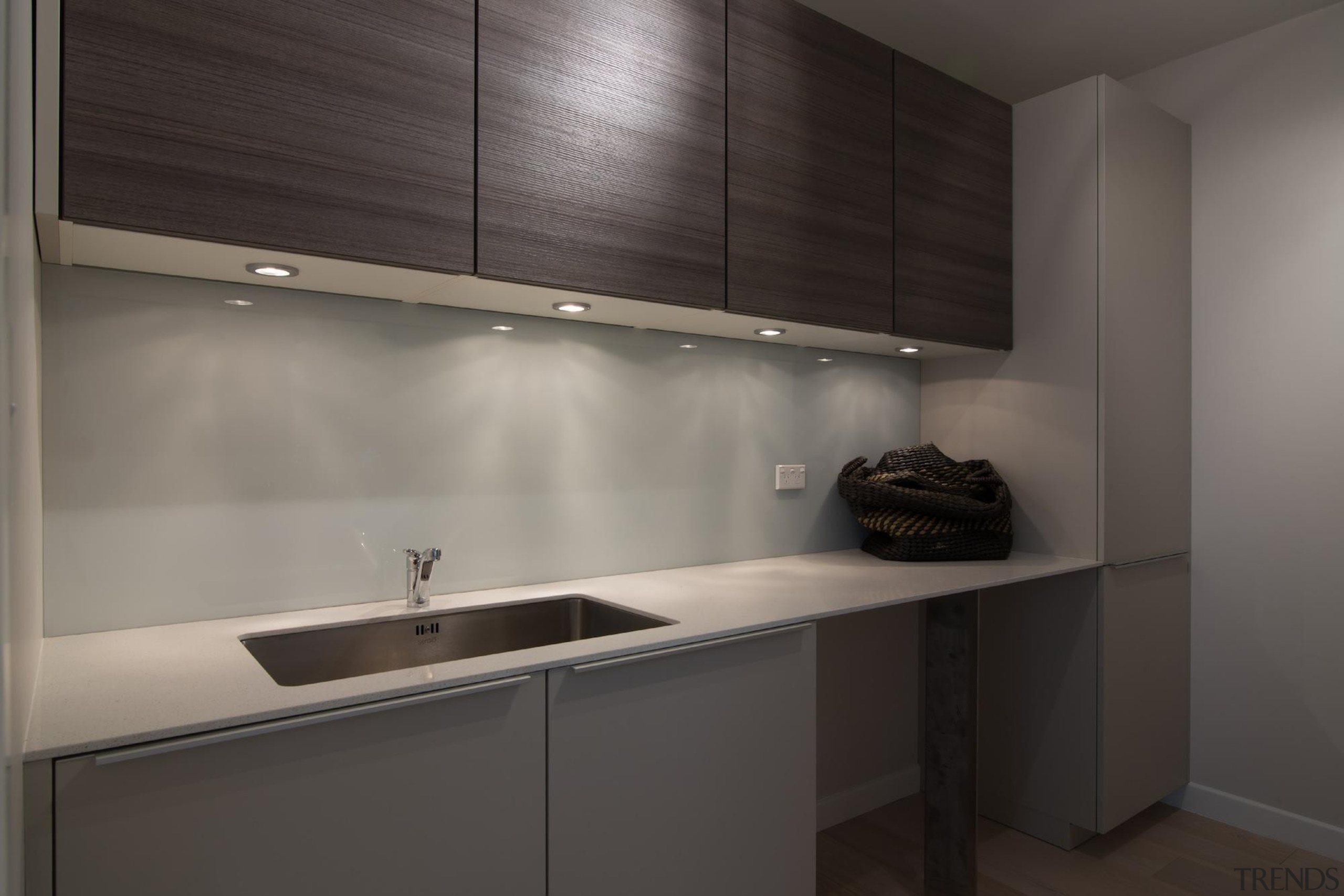 This kitchen's secondary sink is enhanced by sufficient cabinetry, countertop, interior design, kitchen, sink, gray, black