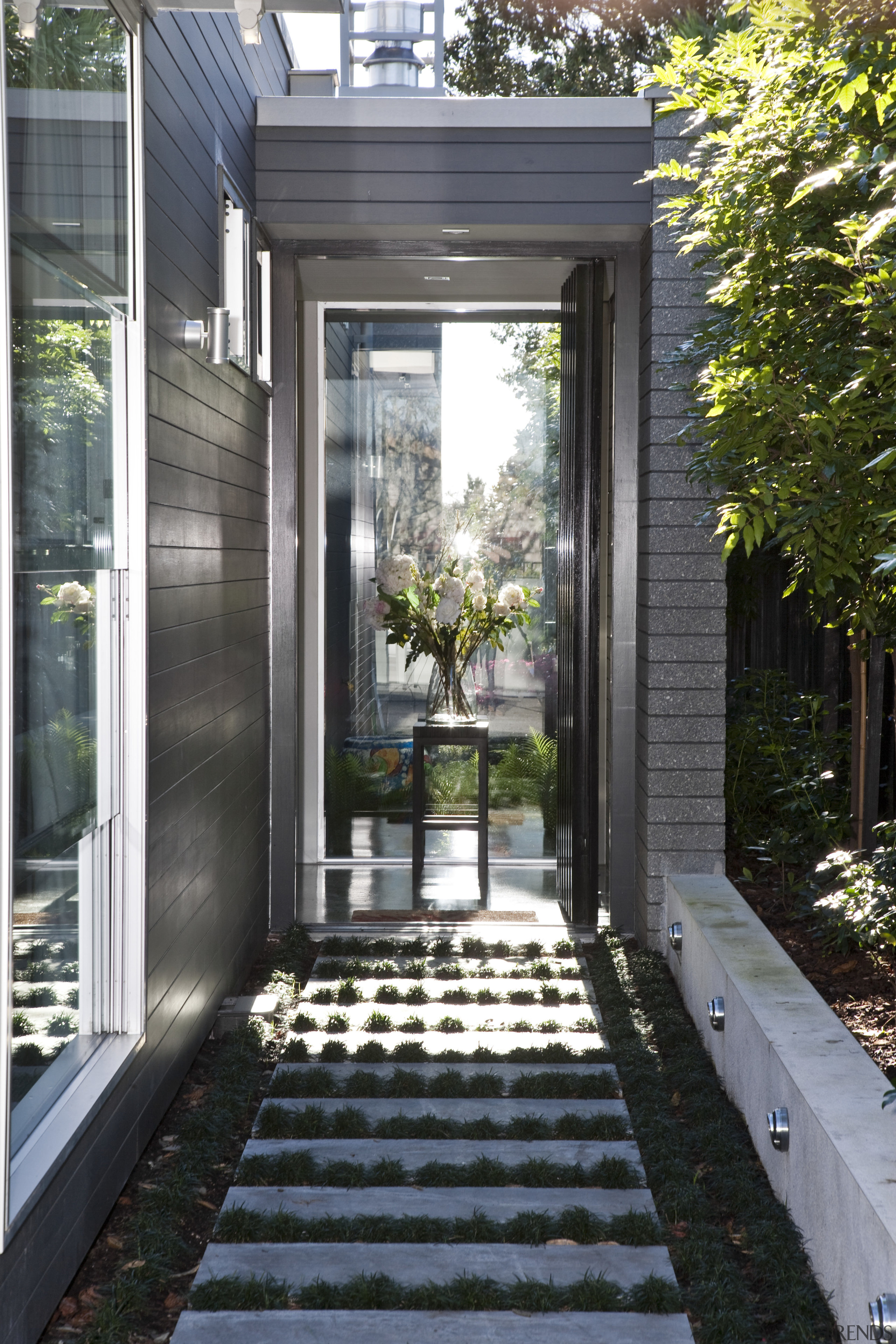 Exterior view of this modern home by Jessop backyard, courtyard, door, home, house, landscaping, outdoor structure, porch, real estate, walkway, window, yard, gray, black