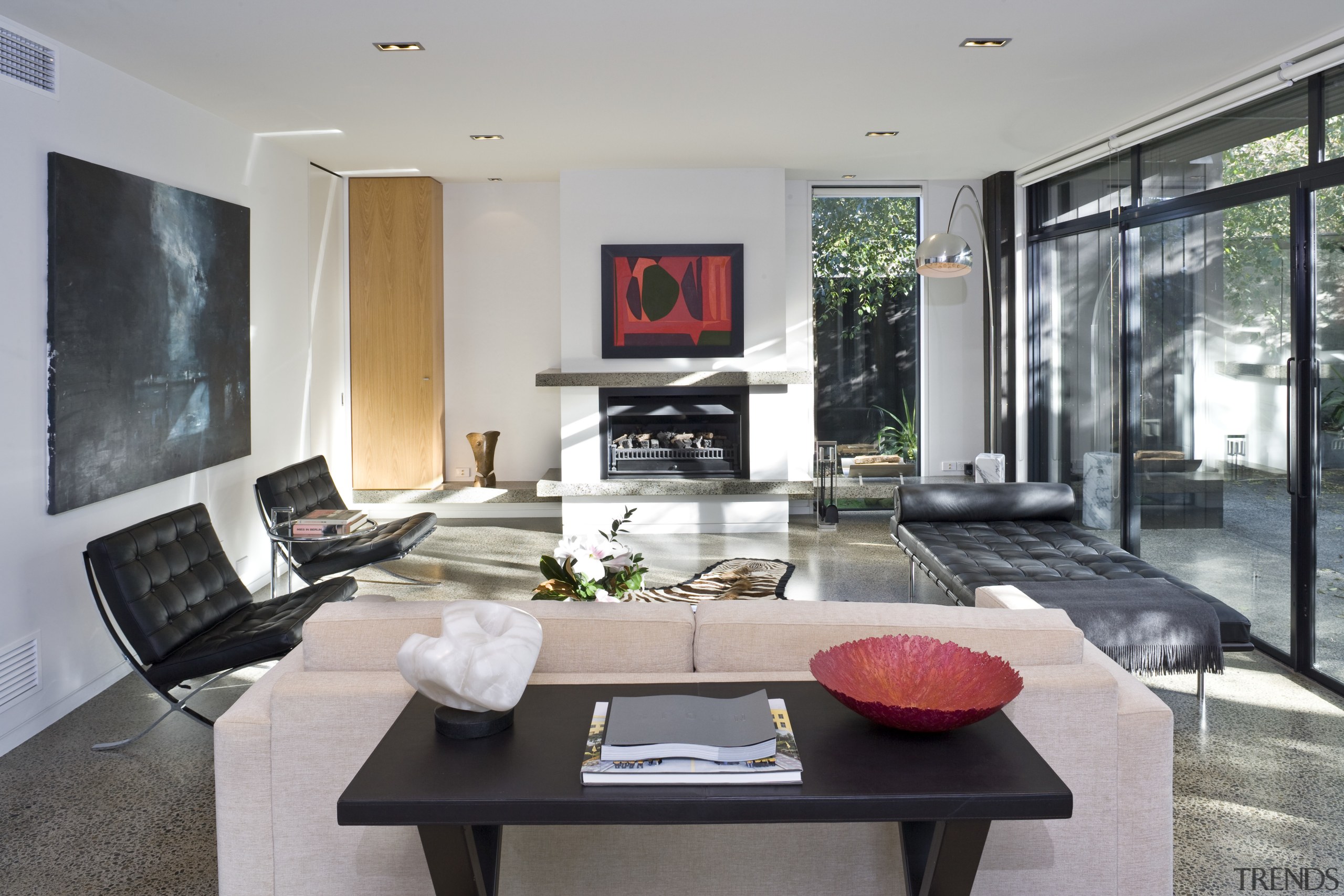 View of living room which features a day house, interior design, living room, real estate, table, gray