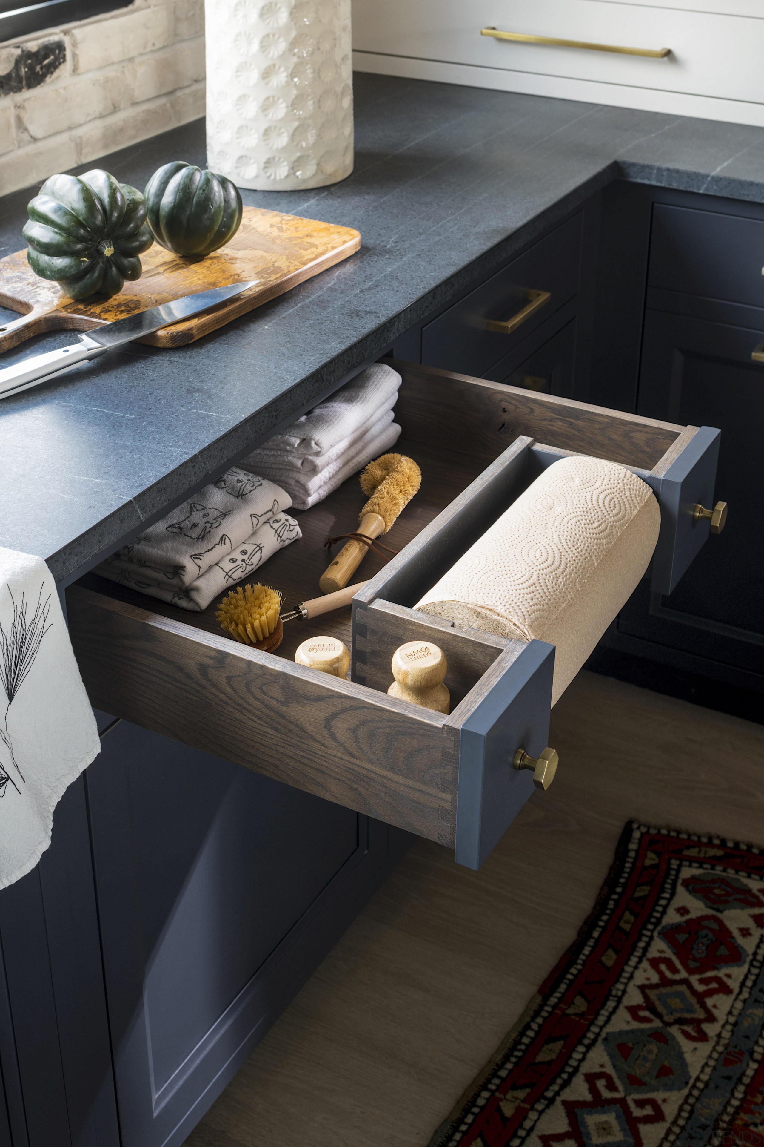 Clever drawer with built-in paper towel dispenser. 