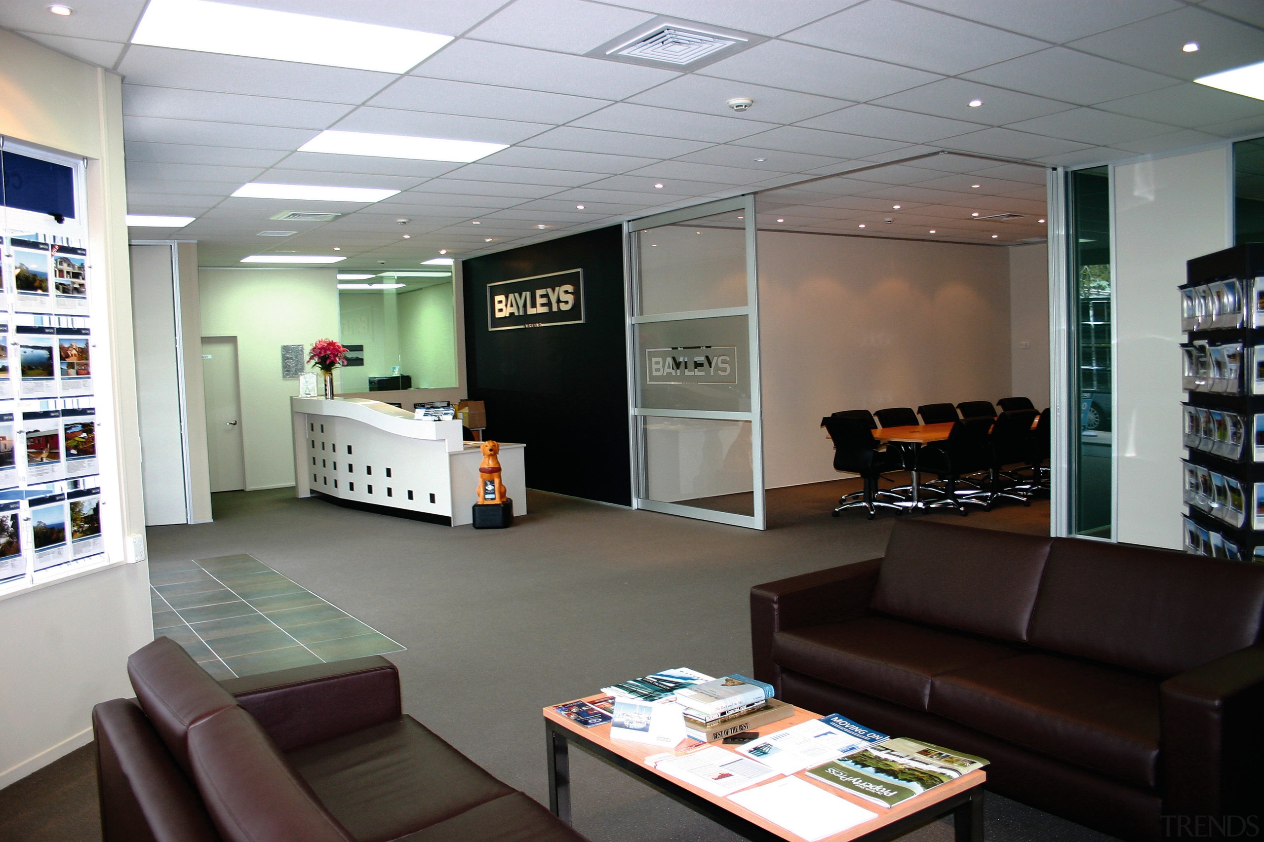 View of Bayleys office reception with black sofas, interior design, office, gray, black