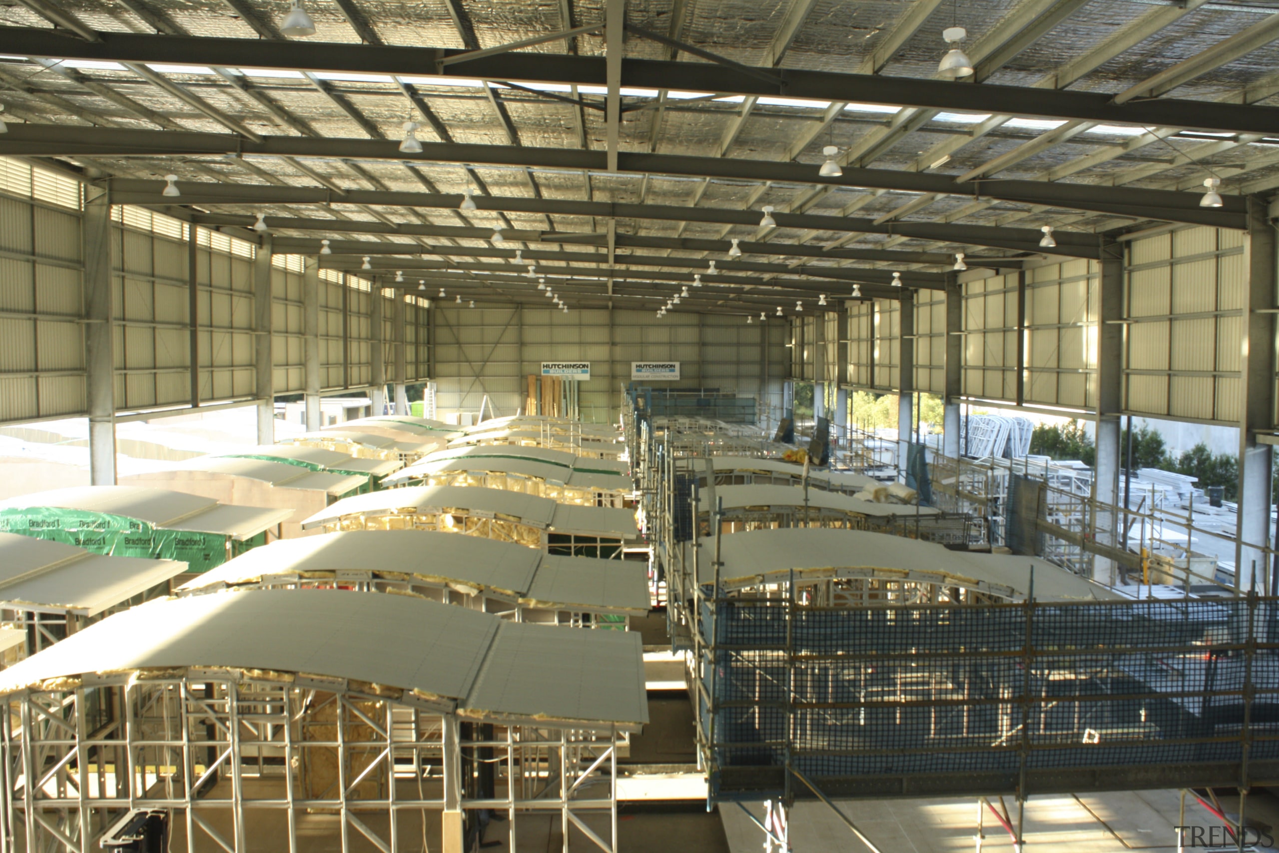 View of building by Hutchinson Builders. - View daylighting, factory, structure, brown
