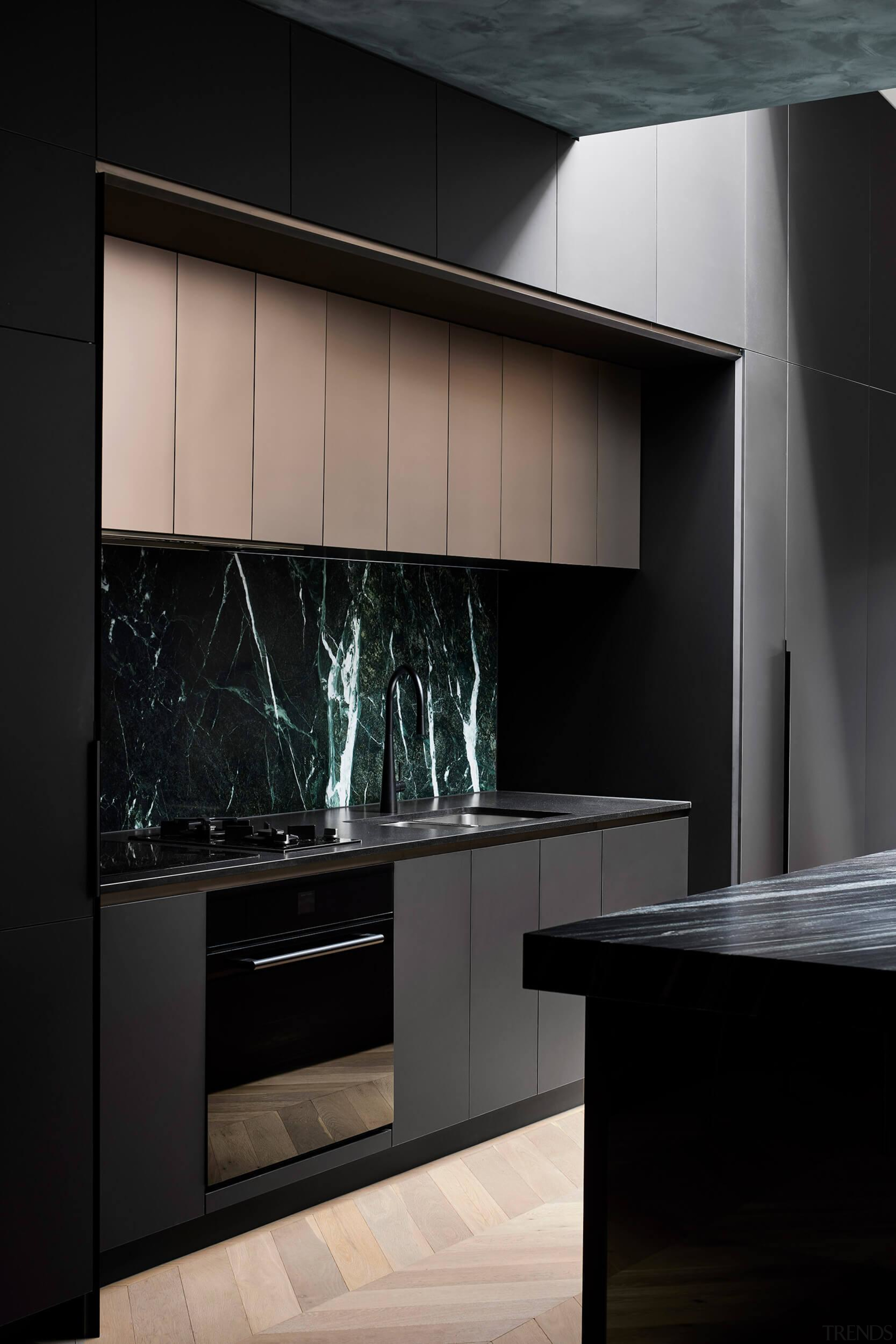 The kitchen features a beautiful noble stone splashback 