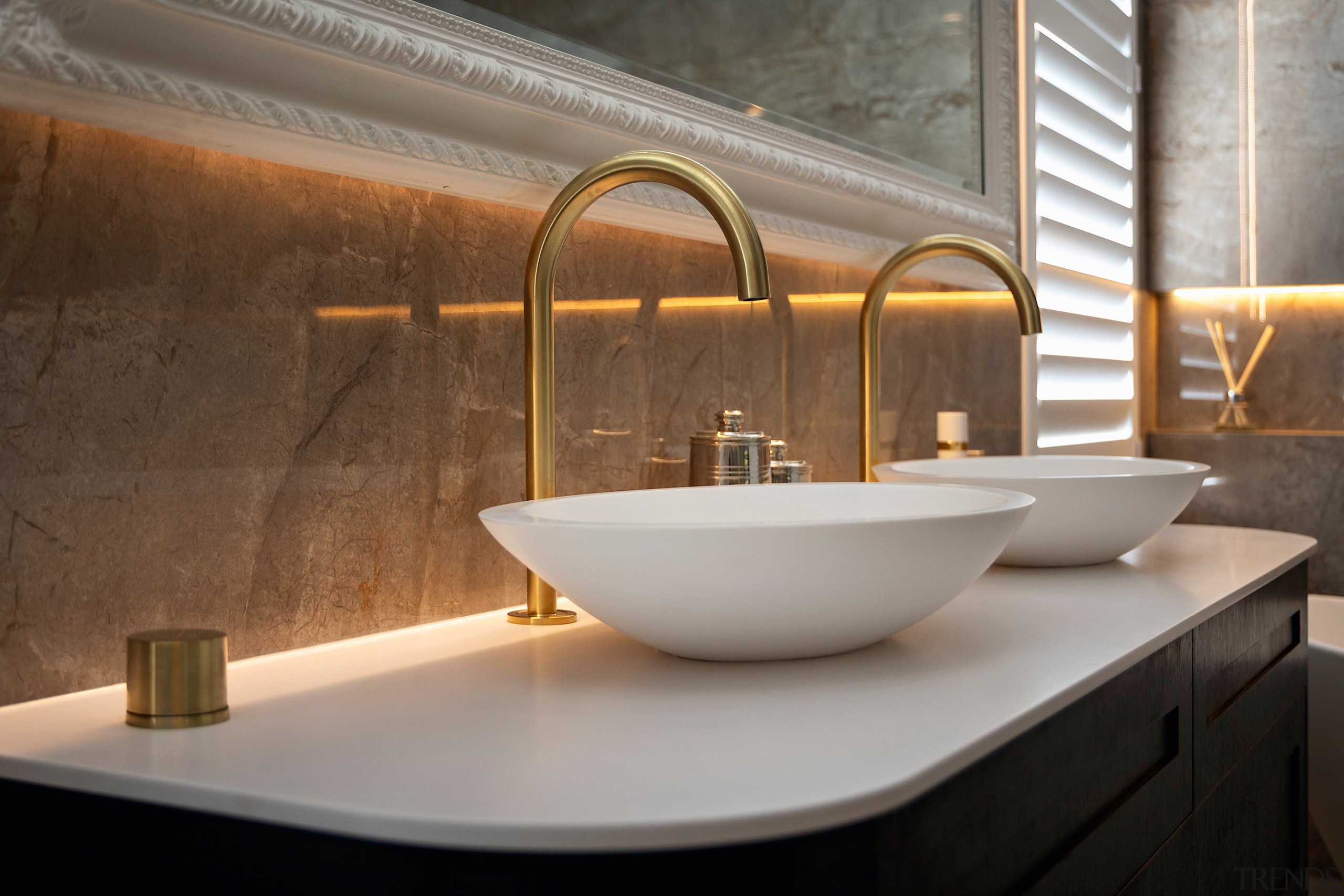 The reflective marble wall tiles add lustre to 