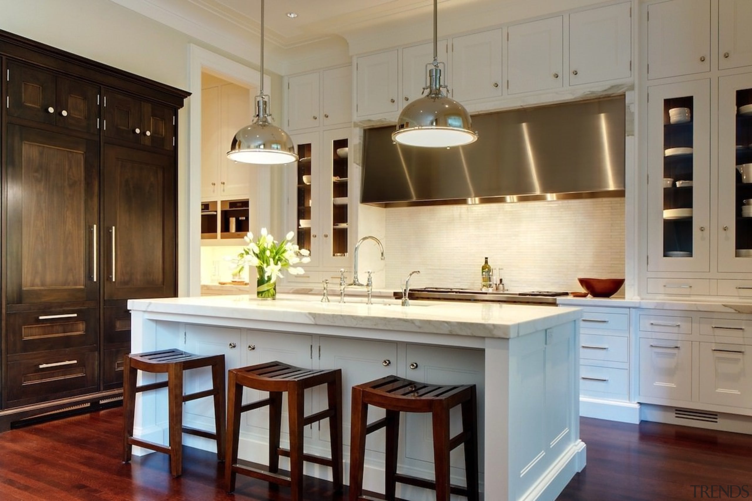 The kitchen is designed for entertaining - The cabinetry, countertop, cuisine classique, hardwood, interior design, kitchen, room, brown, gray