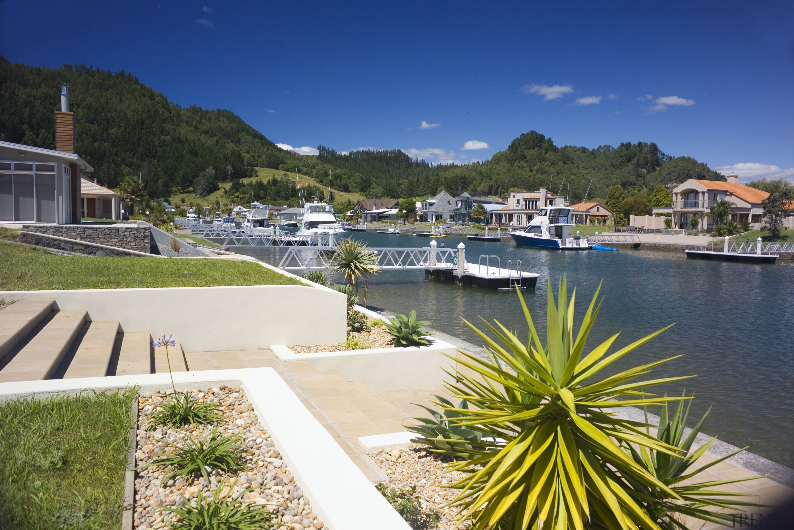 View of new canal-front properties by Hopper Developments. bay, dock, estate, home, leisure, marina, property, real estate, resort, sky, villa, water, waterway