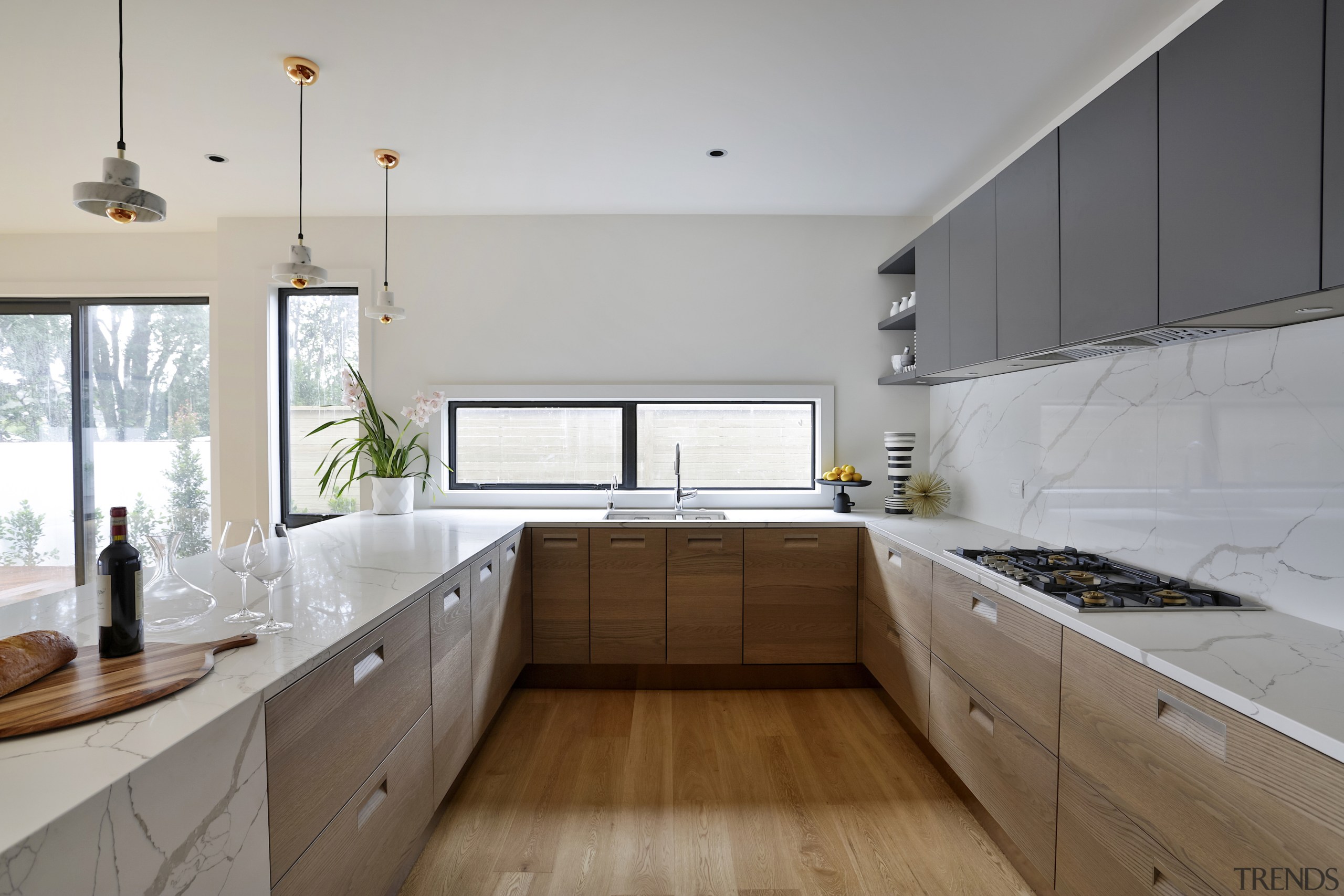 The striking horizontal wood grains of the cabinetry 