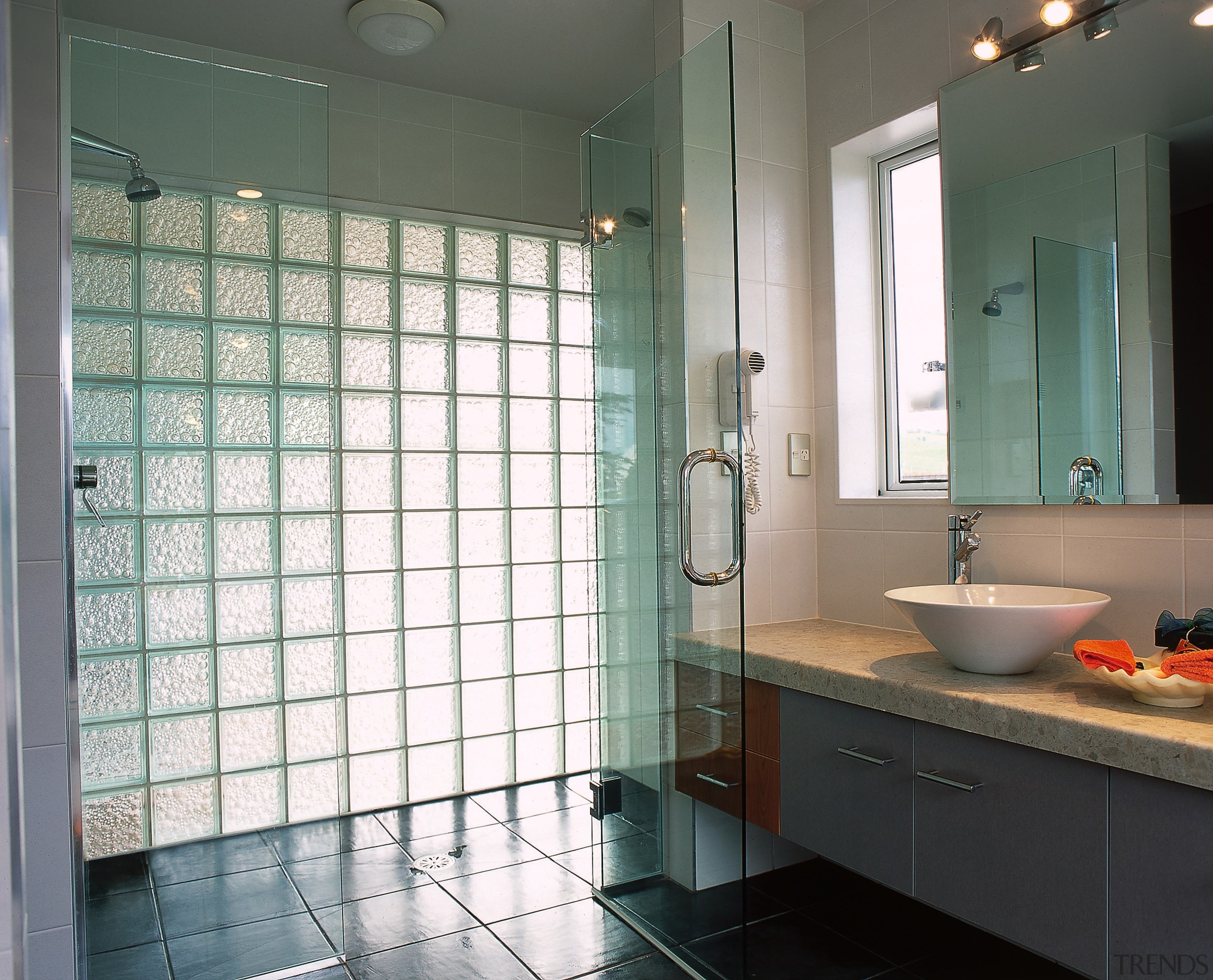 The view of a bathroom featuring bubbled glass bathroom, ceiling, floor, glass, home, interior design, plumbing fixture, room, tile, window, gray