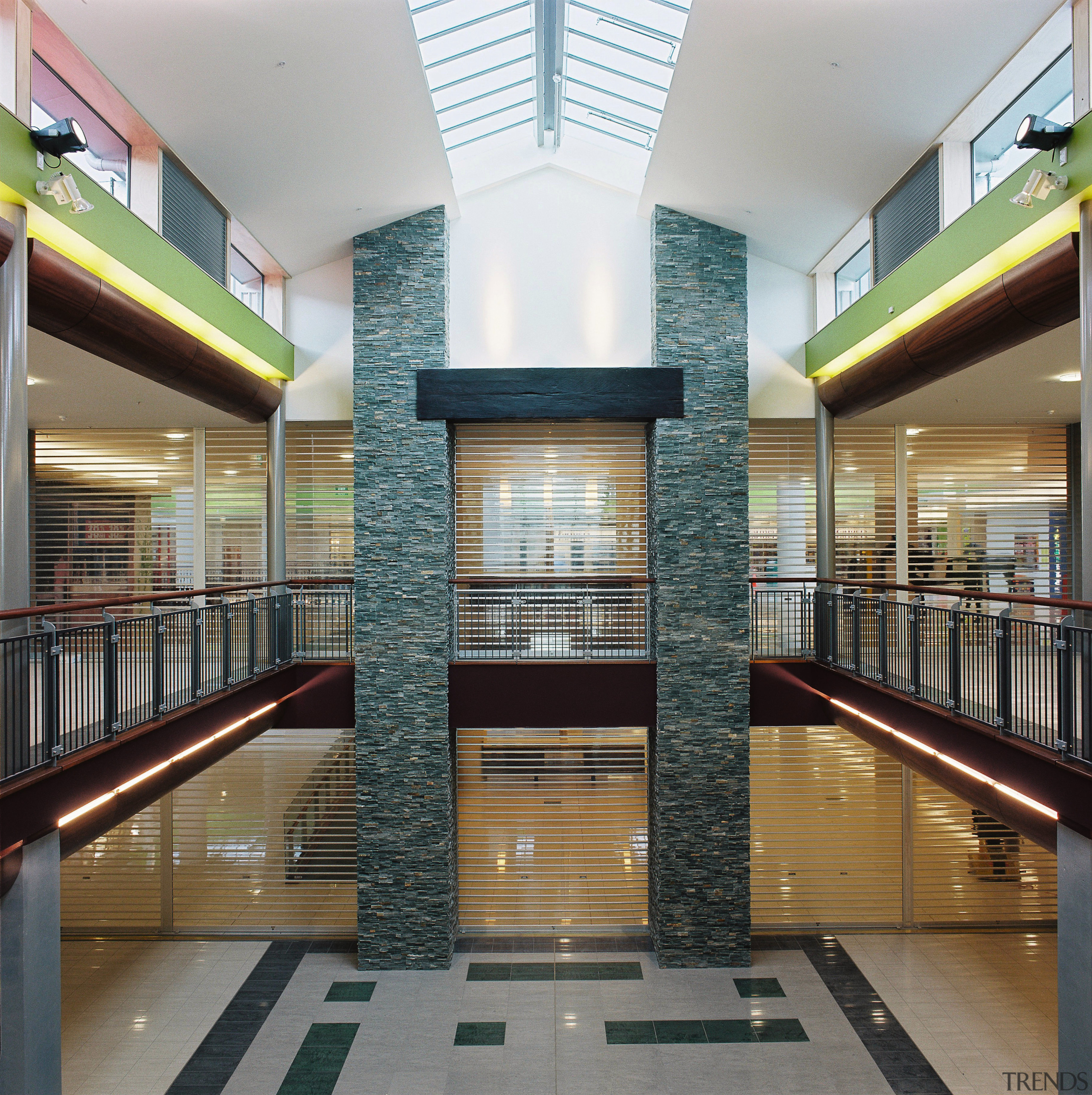 view of the Stoneclad pillars used in the apartment, architecture, building, commercial building, condominium, daylighting, interior design, lobby, mixed use, stairs, gray