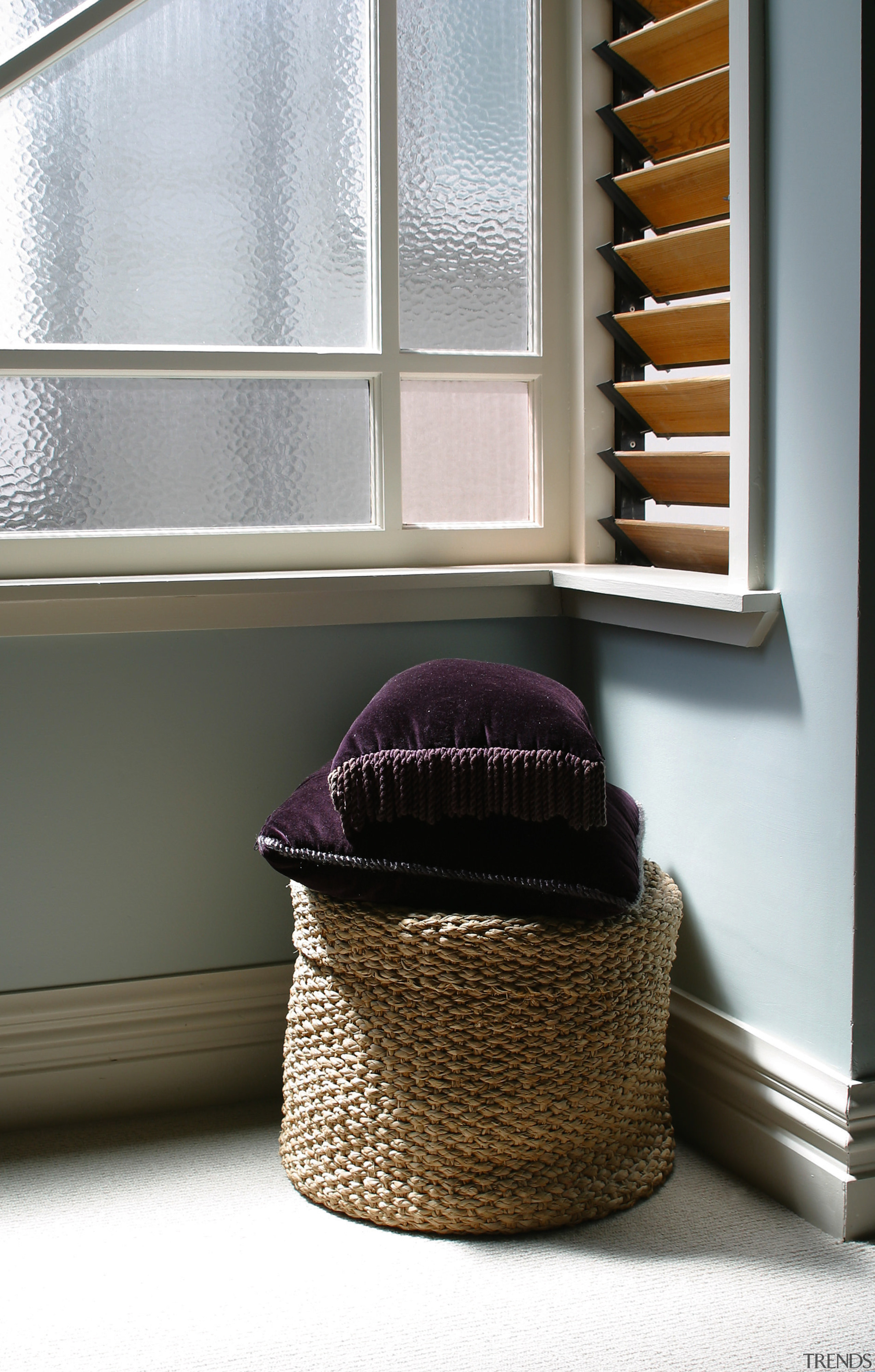 Old woven laundry basket in corner of room flooring, furniture, interior design, product design, window, gray